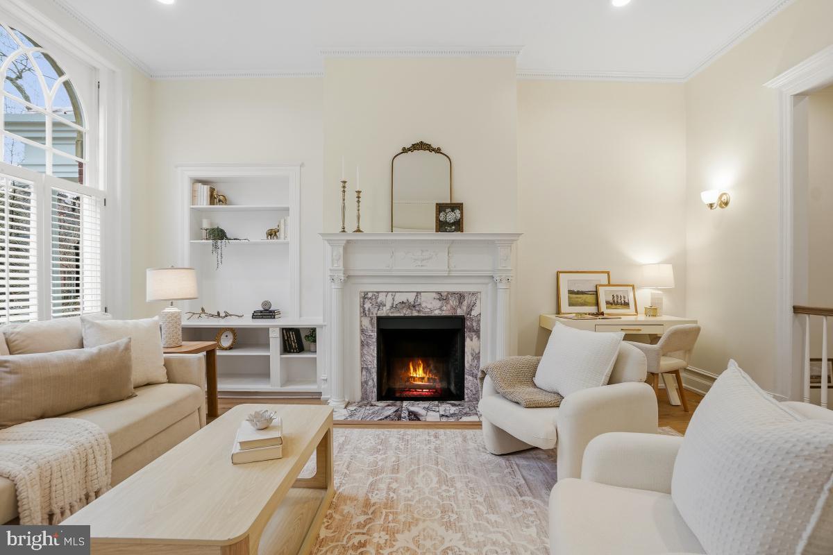 1706 16th Street Northwest, Unit 1 Washington, DC 20009 - Photo 3 of 55 a living room with furniture and a fireplace