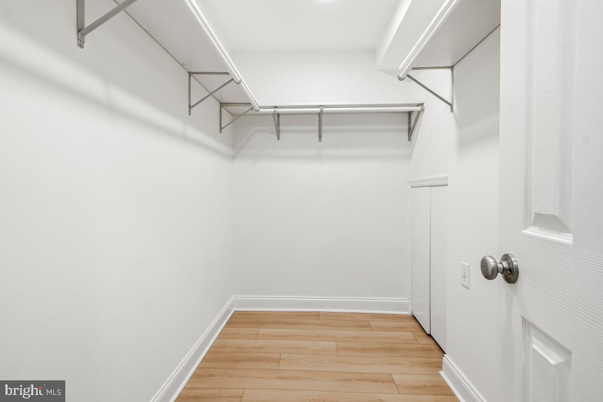 1706 16th Street Northwest, Unit 1 Washington, DC 20009 - Photo 32 of 55 a view of a room with racks on the wall