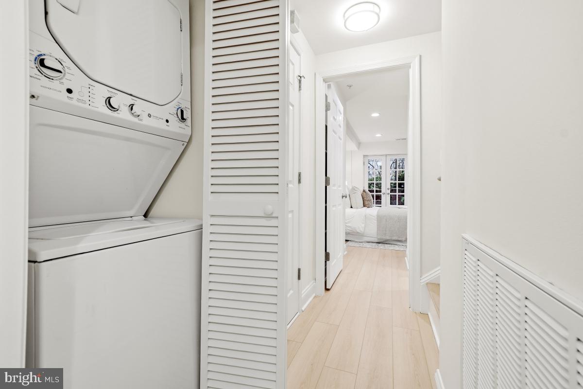1706 16th Street Northwest, Unit 1 Washington, DC 20009 - Photo 33 of 55 a view of a hallway with white walls and stairs