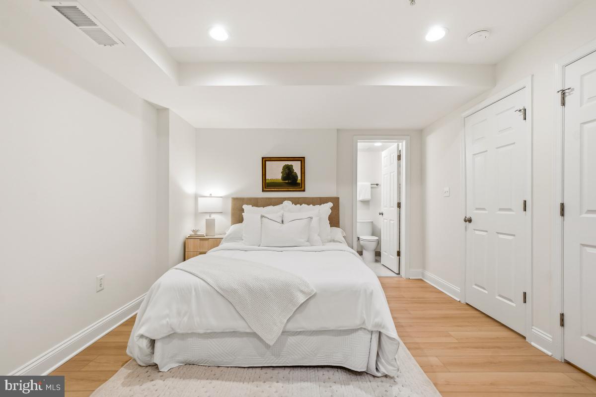 1706 16th Street Northwest, Unit 1 Washington, DC 20009 - Photo 34 of 55 a bedroom with a bed and a night stand