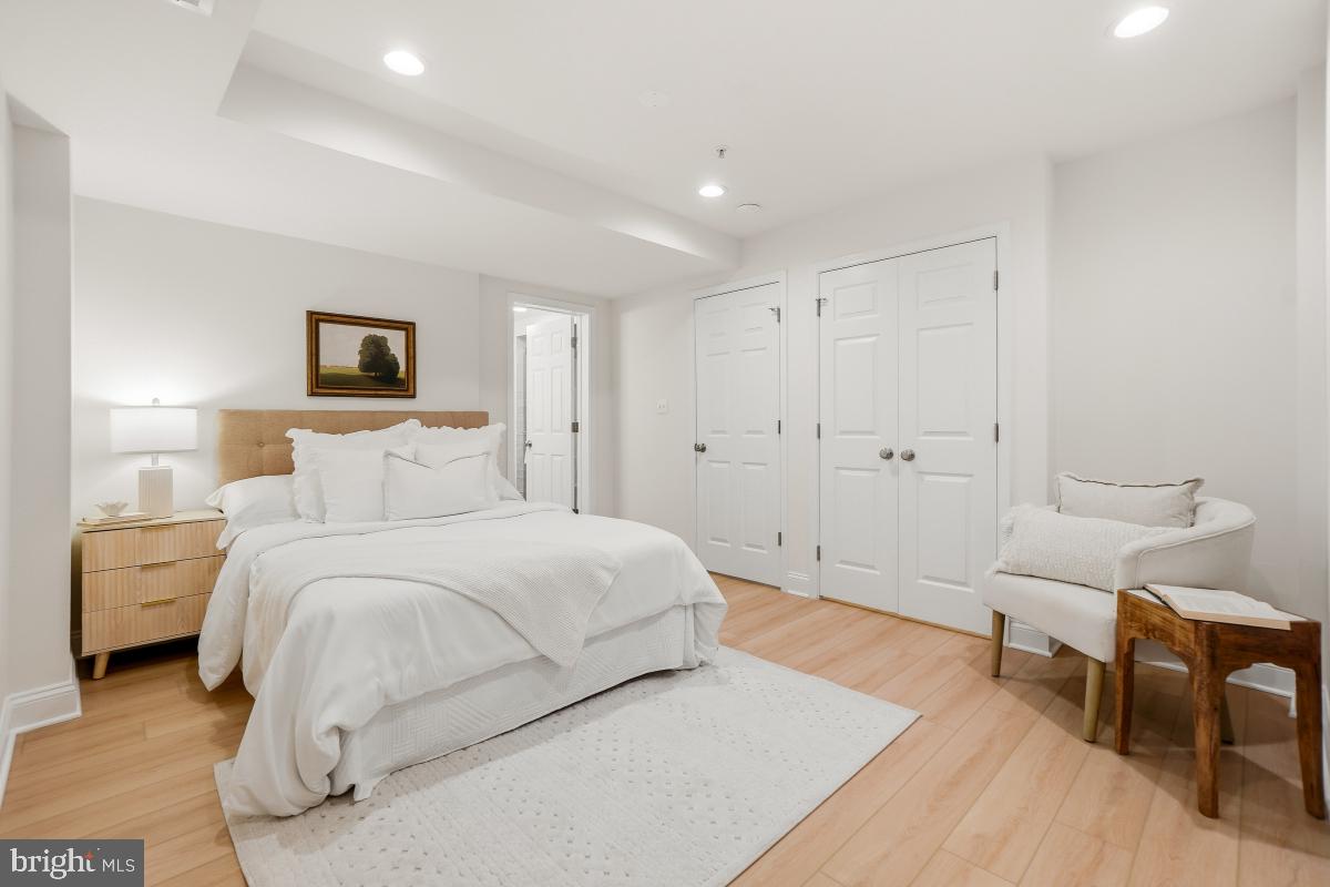 1706 16th Street Northwest, Unit 1 Washington, DC 20009 - Photo 35 of 55 a spacious bedroom with a bed and a table