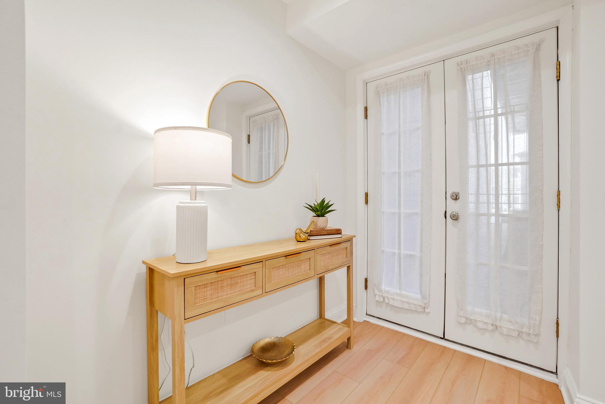 1706 16th Street Northwest, Unit 1 Washington, DC 20009 - Photo 36 of 55 a room with a mirror and a shower
