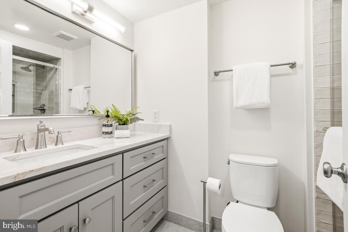 1706 16th Street Northwest, Unit 1 Washington, DC 20009 - Photo 37 of 55 a bathroom with a toilet sink and mirror
