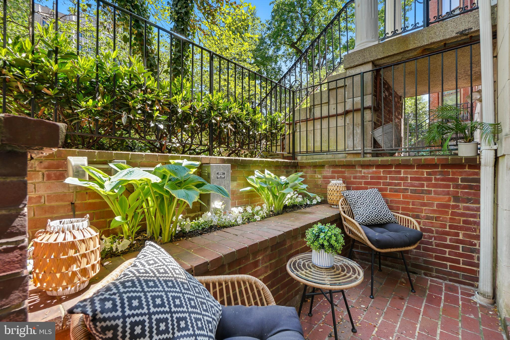 1706 16th Street Northwest, Unit 1 Washington, DC 20009 - Photo 39 of 55 a view of a chairs and table in backyard