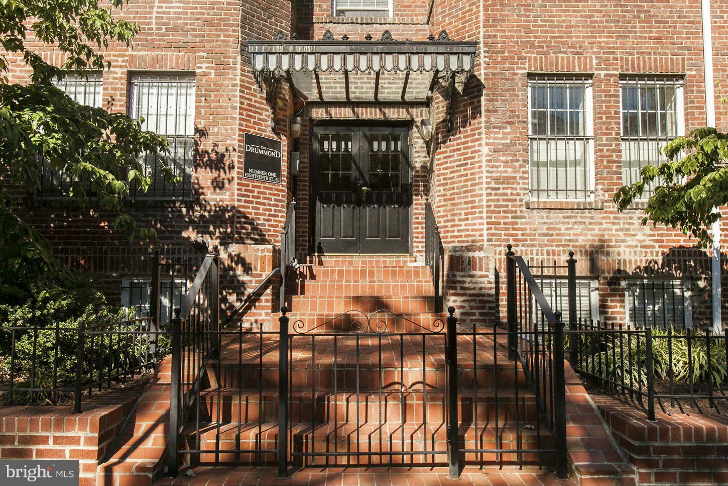 1 18th Street Southeast, Unit 301 Washington, DC 20003 - Photo 1 of 19 a front view of a house with glass windows