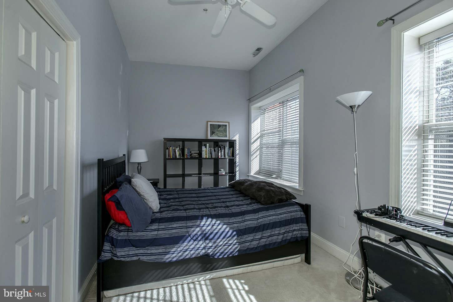 1 18th Street Southeast, Unit 301 Washington, DC 20003 - Photo 12 of 19 a bedroom with furniture and a window