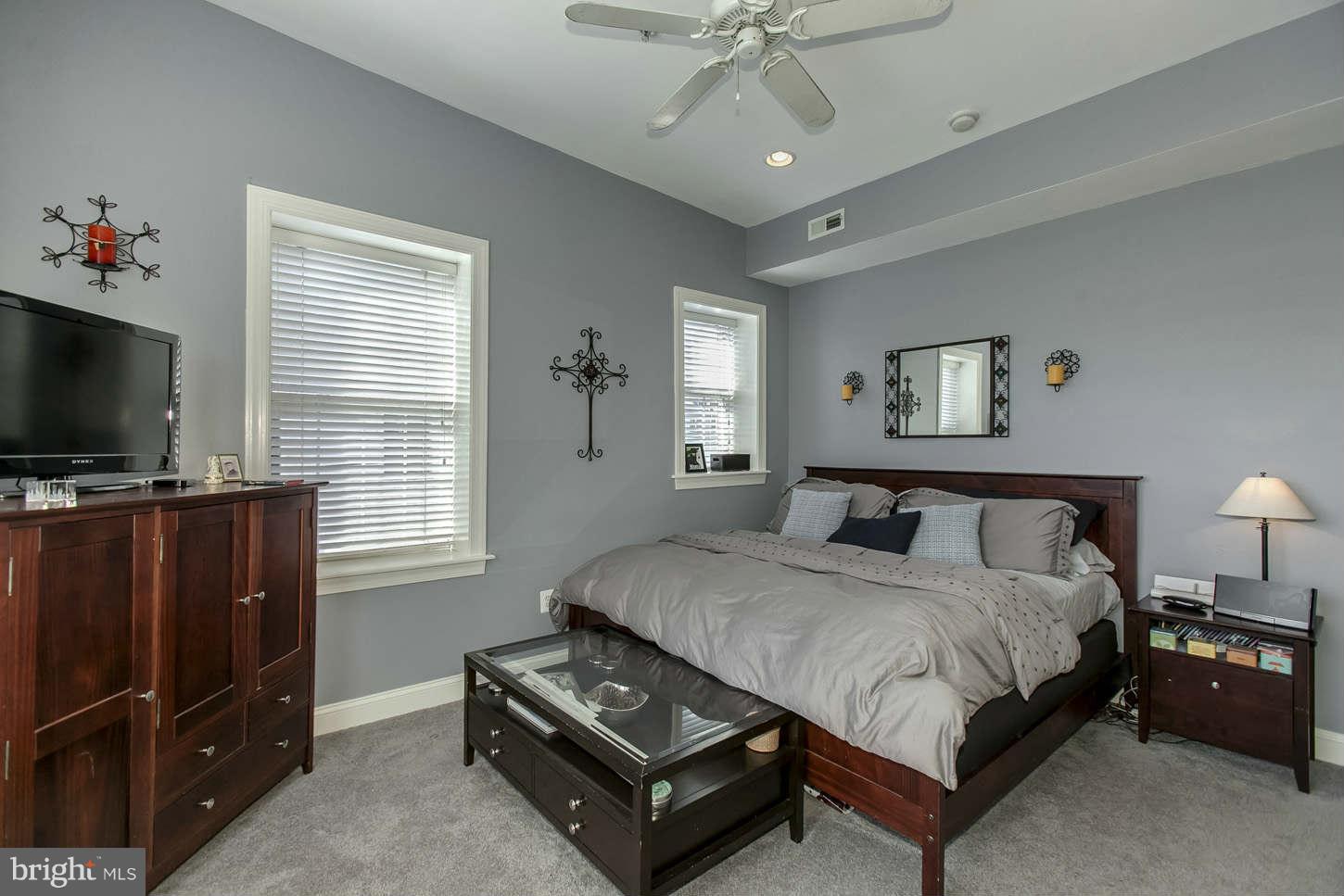 1 18th Street Southeast, Unit 301 Washington, DC 20003 - Photo 10 of 19 a spacious bedroom with a bed and a flat screen television
