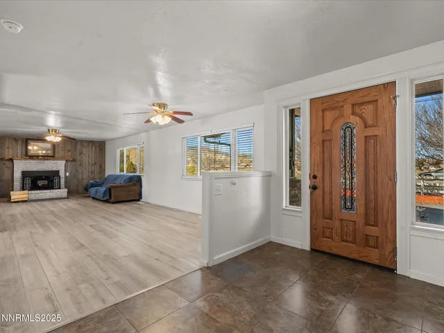 a view of livingroom with hardwood floor and a ceiling fan