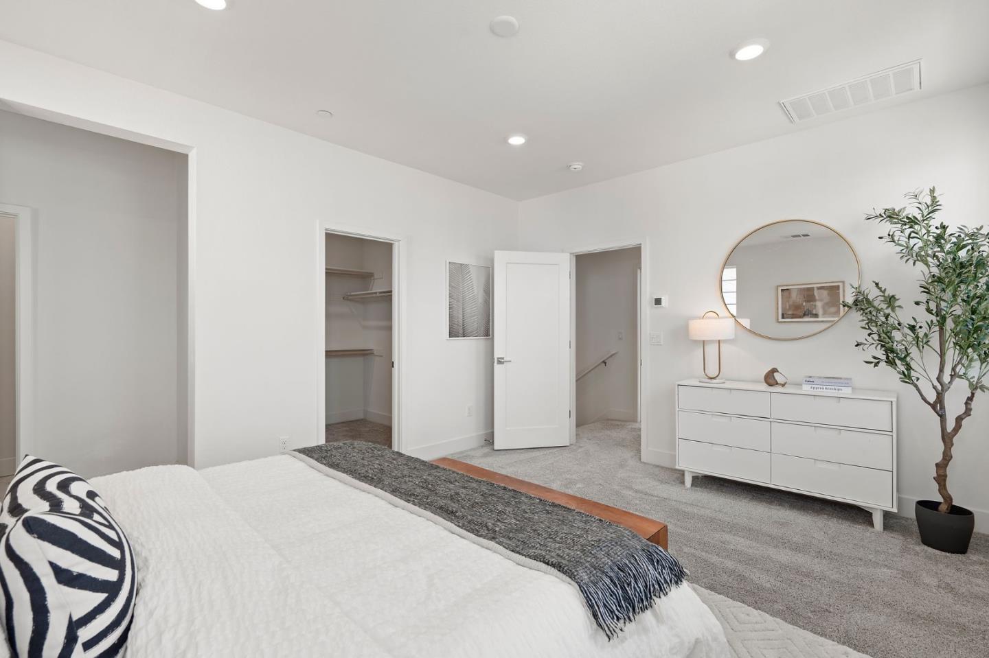 9488 Seawind Way Newark, CA 94560 - Photo 20 of 33 a spacious bedroom with a bed and a dresser