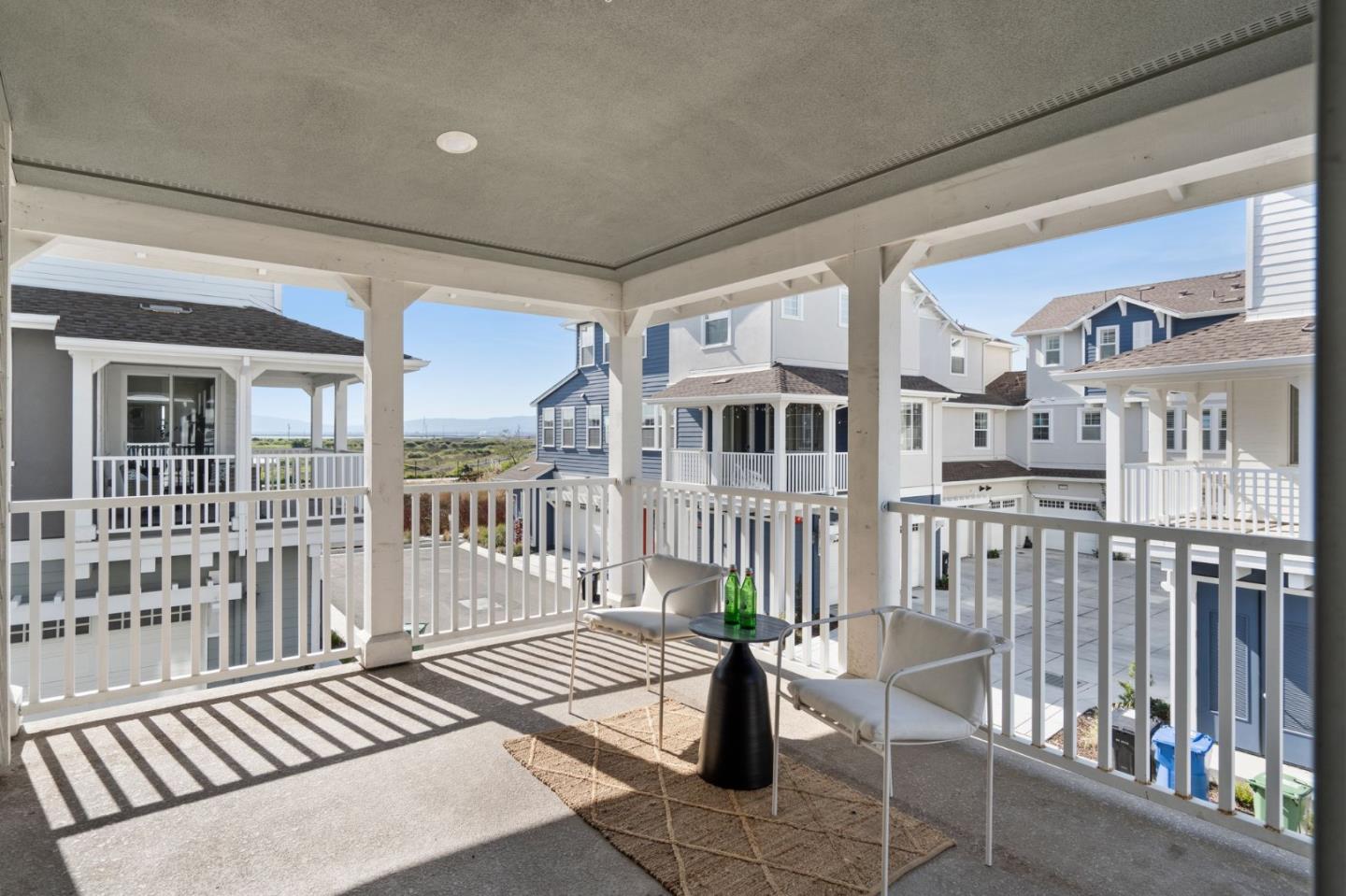 9488 Seawind Way Newark, CA 94560 - Photo 25 of 33 a view of a balcony with wooden chairs