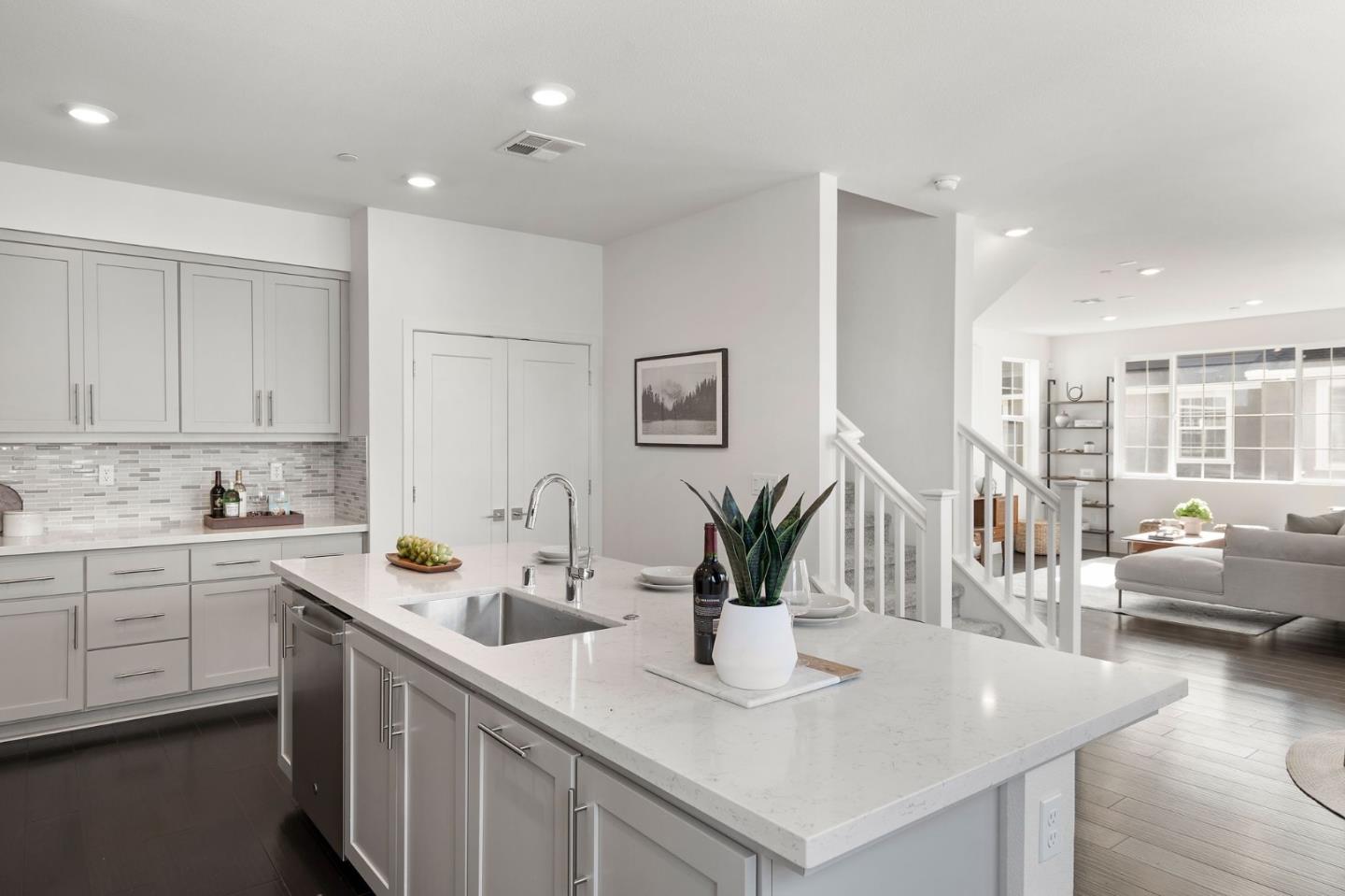 9488 Seawind Way Newark, CA 94560 - Photo 9 of 33 a kitchen with counter space cabinets and living room