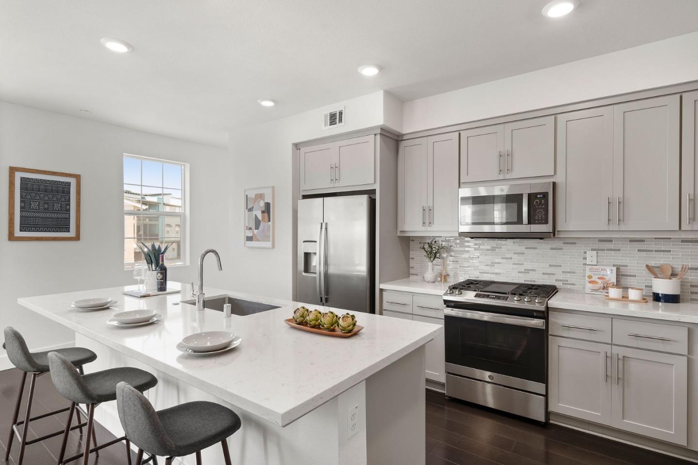 9488 Seawind Way Newark, CA 94560 - Photo 10 of 33 a kitchen that has a table and chairs in it