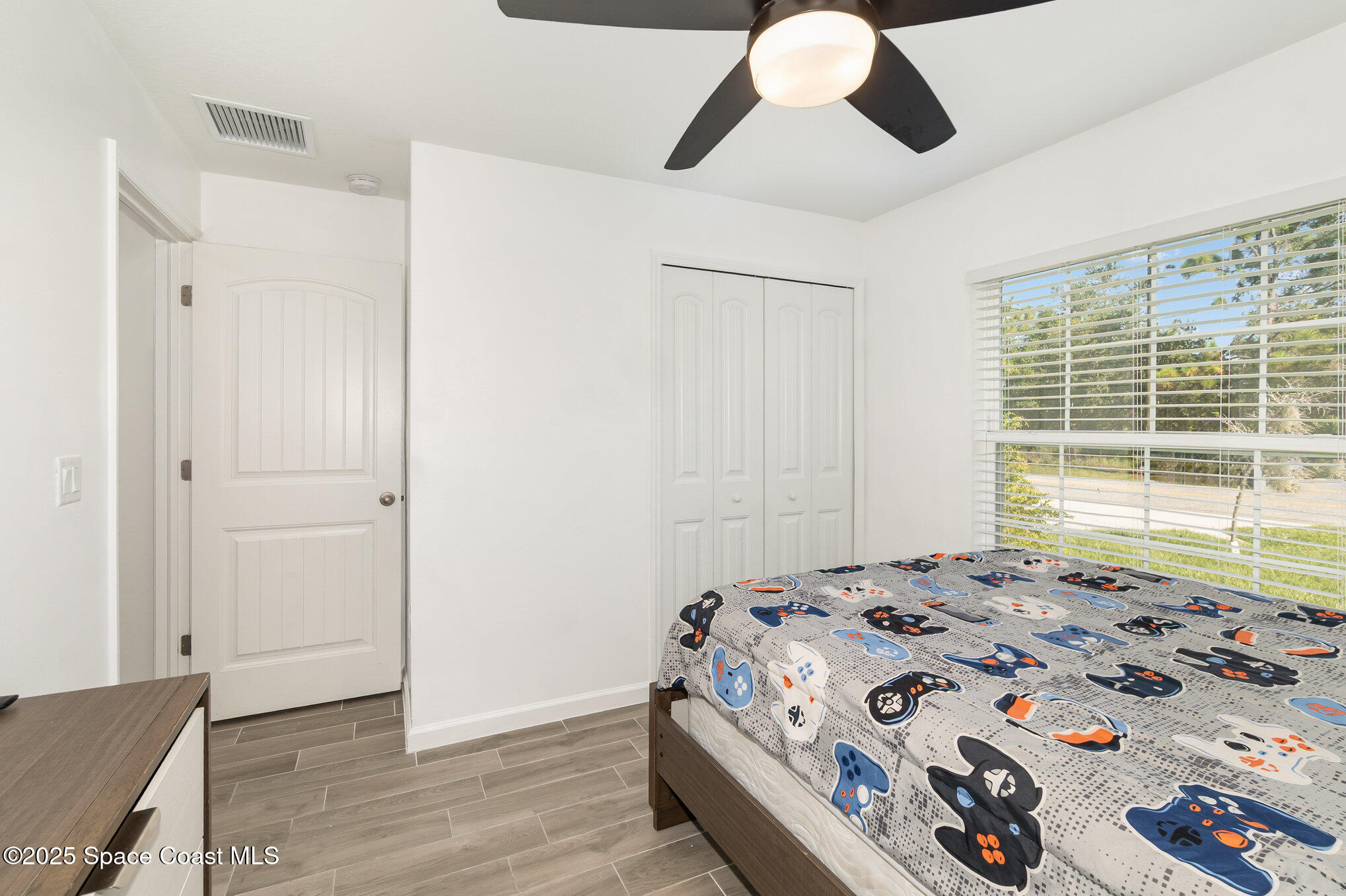 1534 Pine Street Orlando, FL 32824 - Photo 11 of 28 a bedroom with a bed and a window