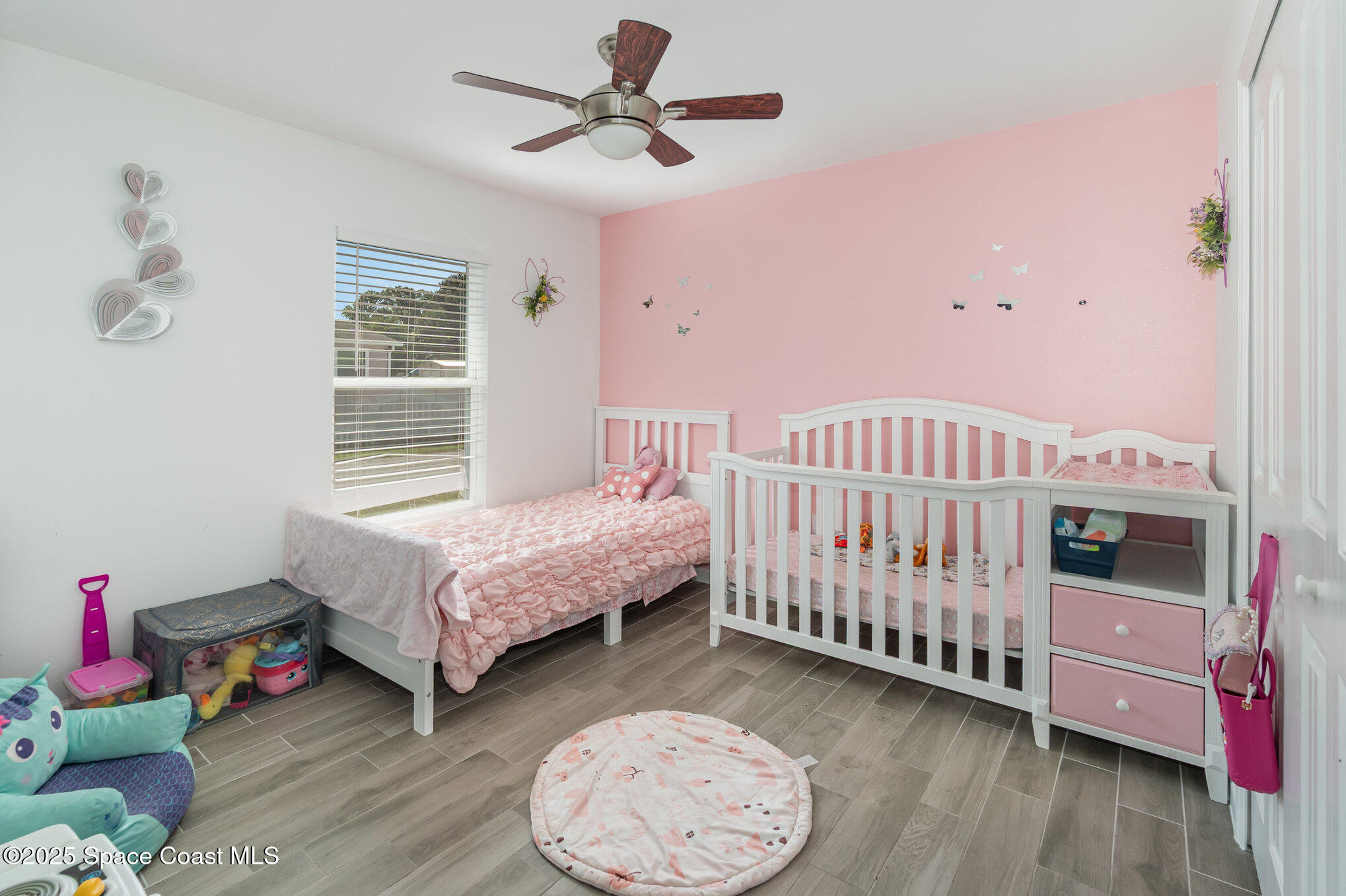 1534 Pine Street Orlando, FL 32824 - Photo 16 of 28 a bedroom with furniture and a window