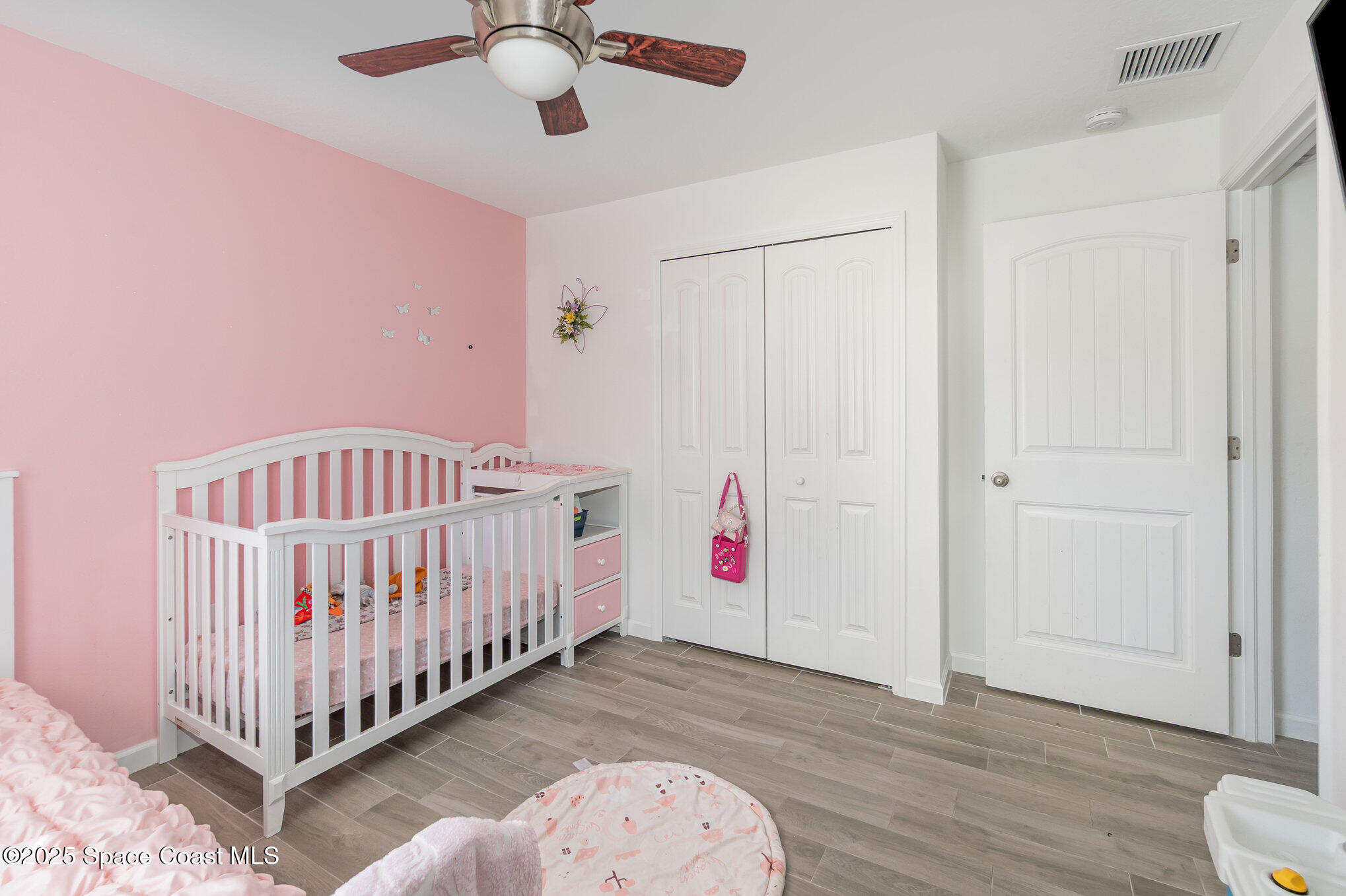 1534 Pine Street Orlando, FL 32824 - Photo 17 of 28 a view of a bedroom with wooden floor
