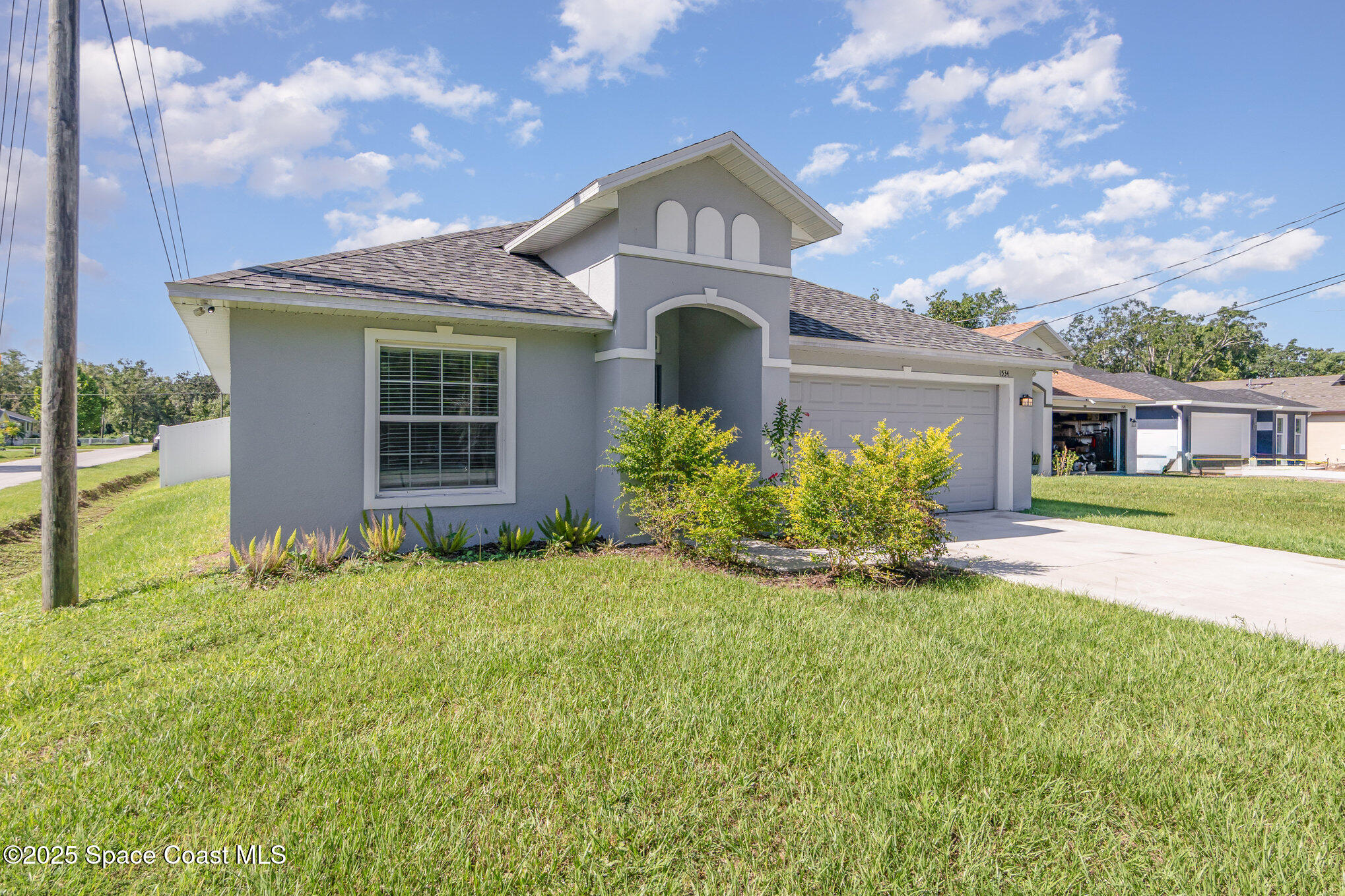 1534 Pine Street Orlando, FL 32824 - Photo 2 of 28 a front view of a house with a yard