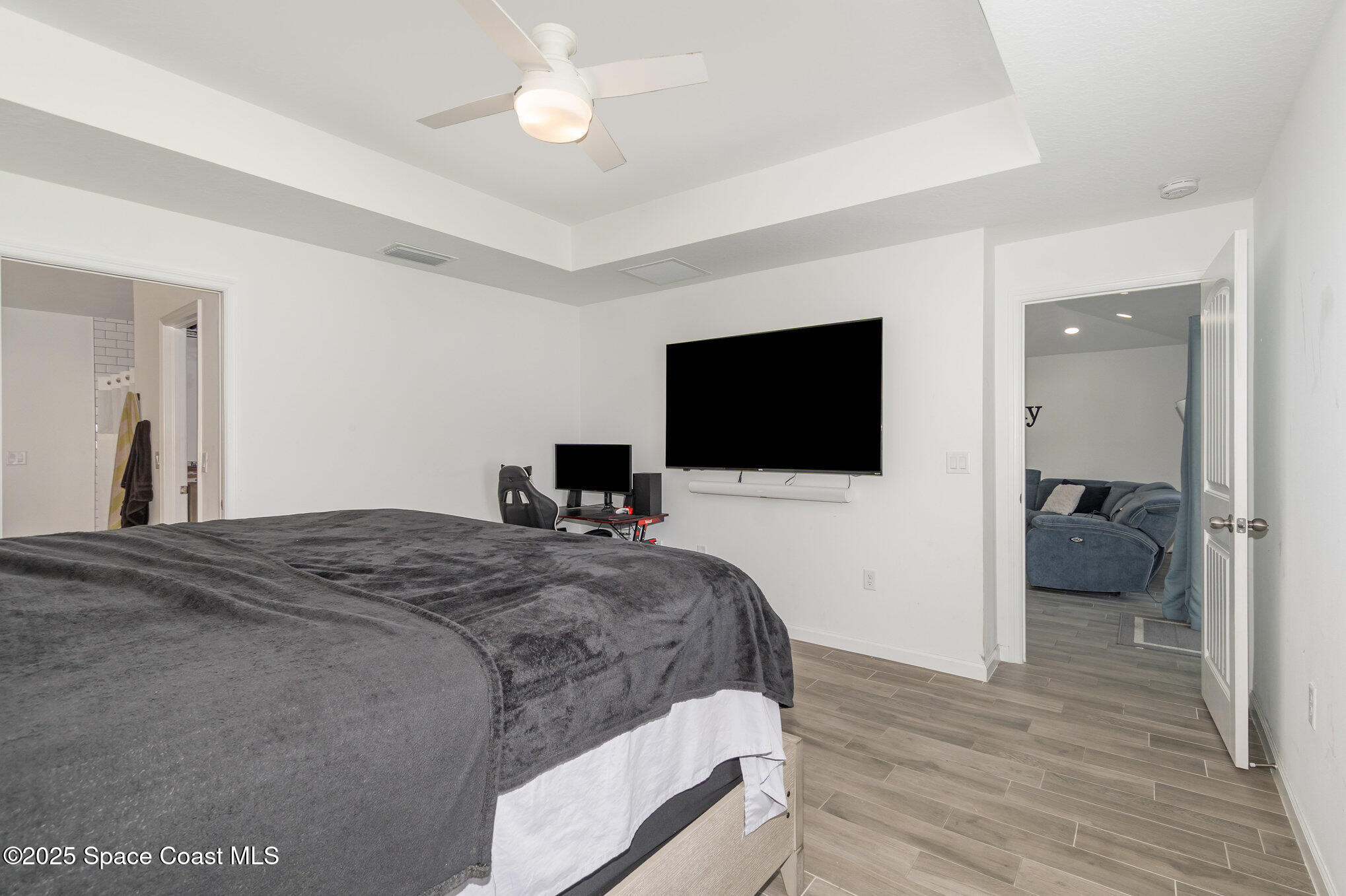 1534 Pine Street Orlando, FL 32824 - Photo 22 of 28 a bedroom with a bed and a flat screen tv