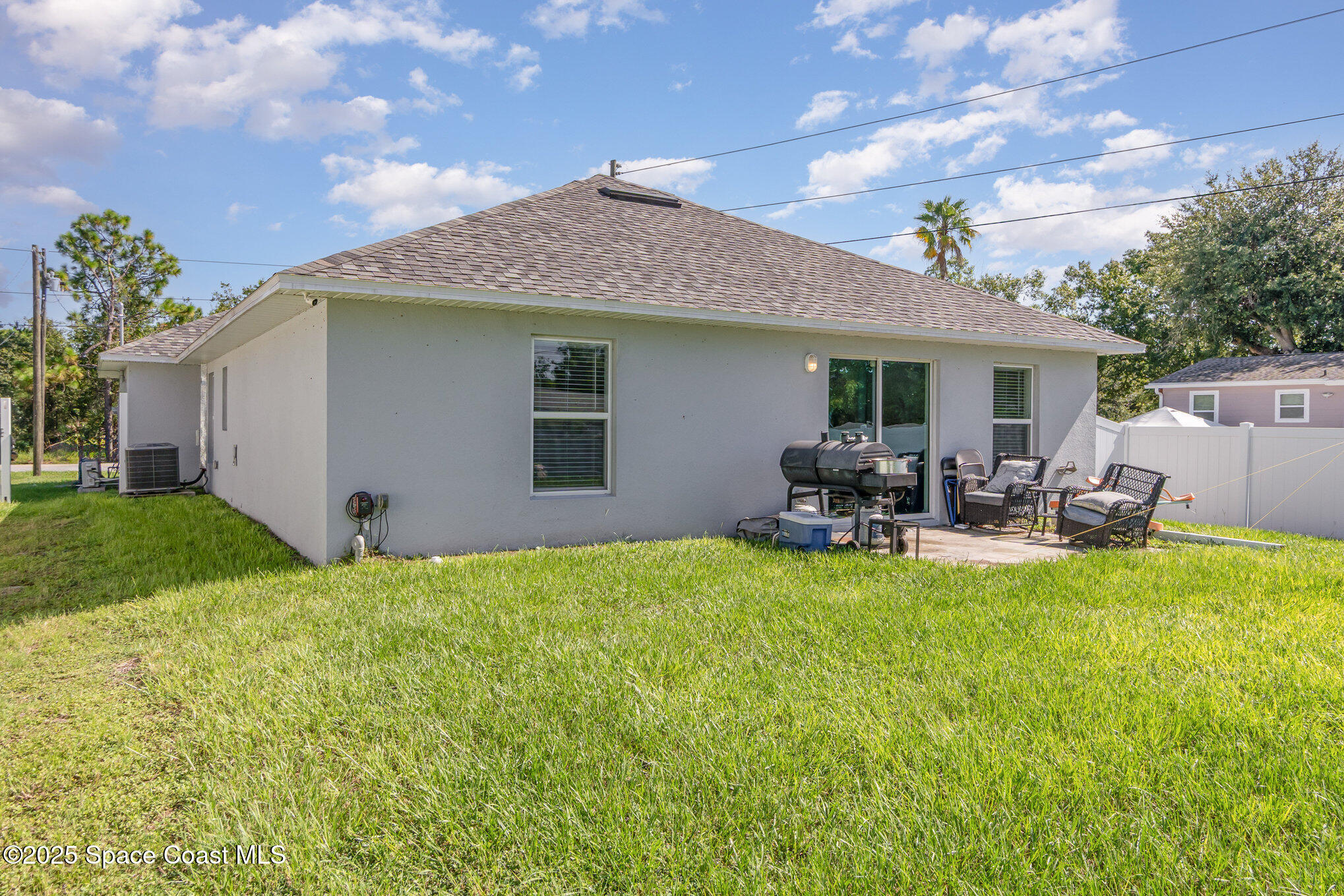1534 Pine Street Orlando, FL 32824 - Photo 25 of 28 a view of a house with backyard porch and furniture