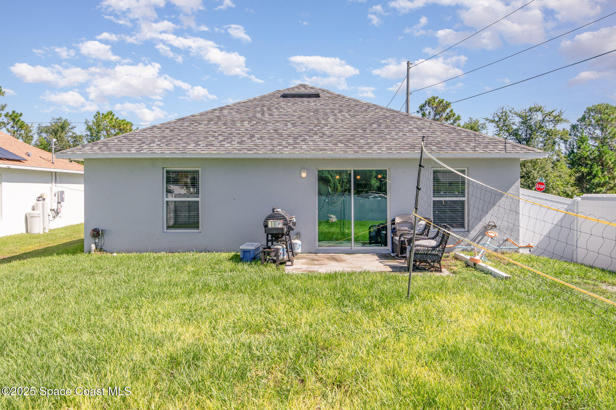 1534 Pine Street Orlando, FL 32824 - Photo 26 of 28 a backyard of a house with table and chairs
