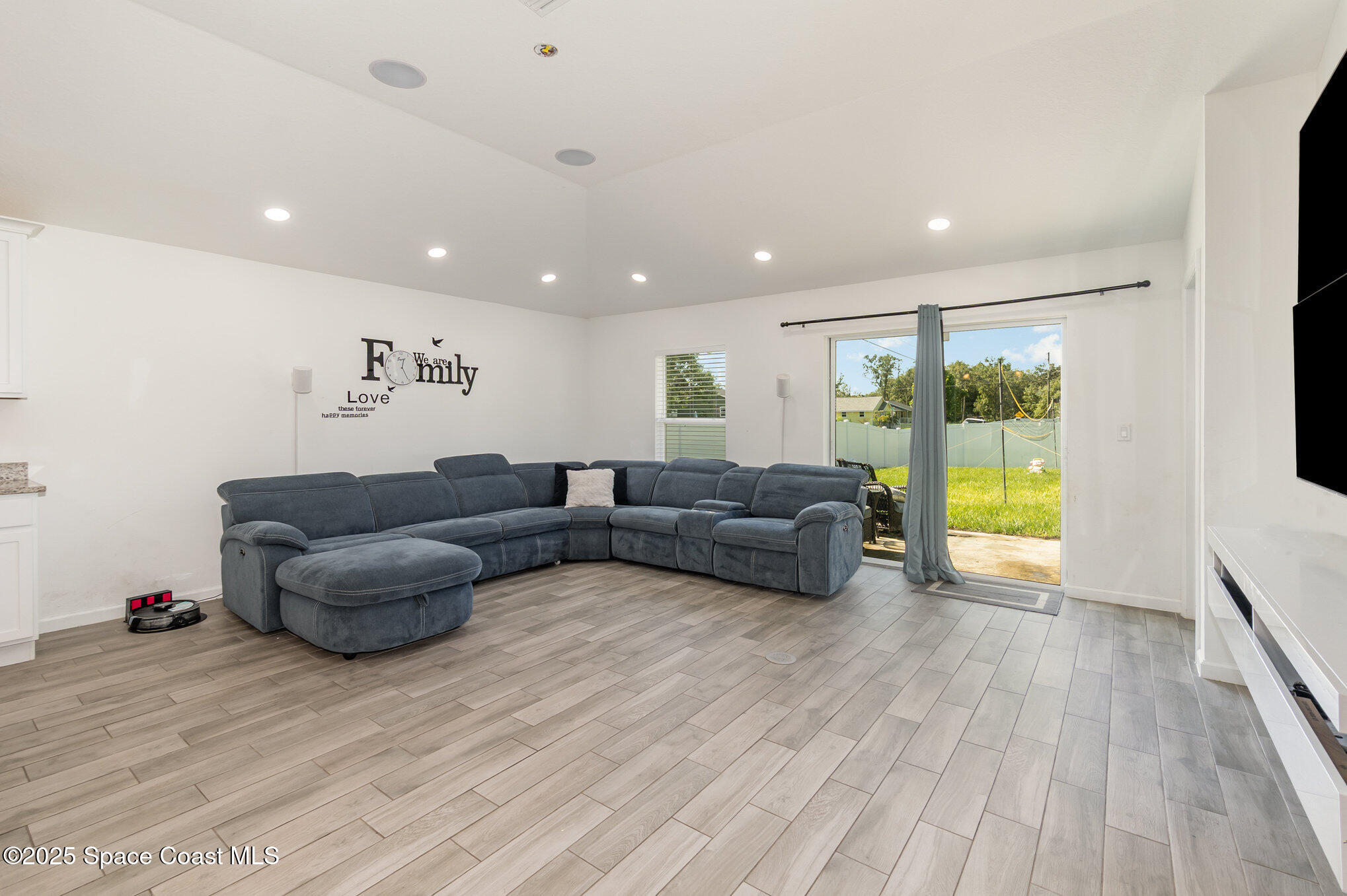1534 Pine Street Orlando, FL 32824 - Photo 4 of 28 a living room with furniture and a wooden floor