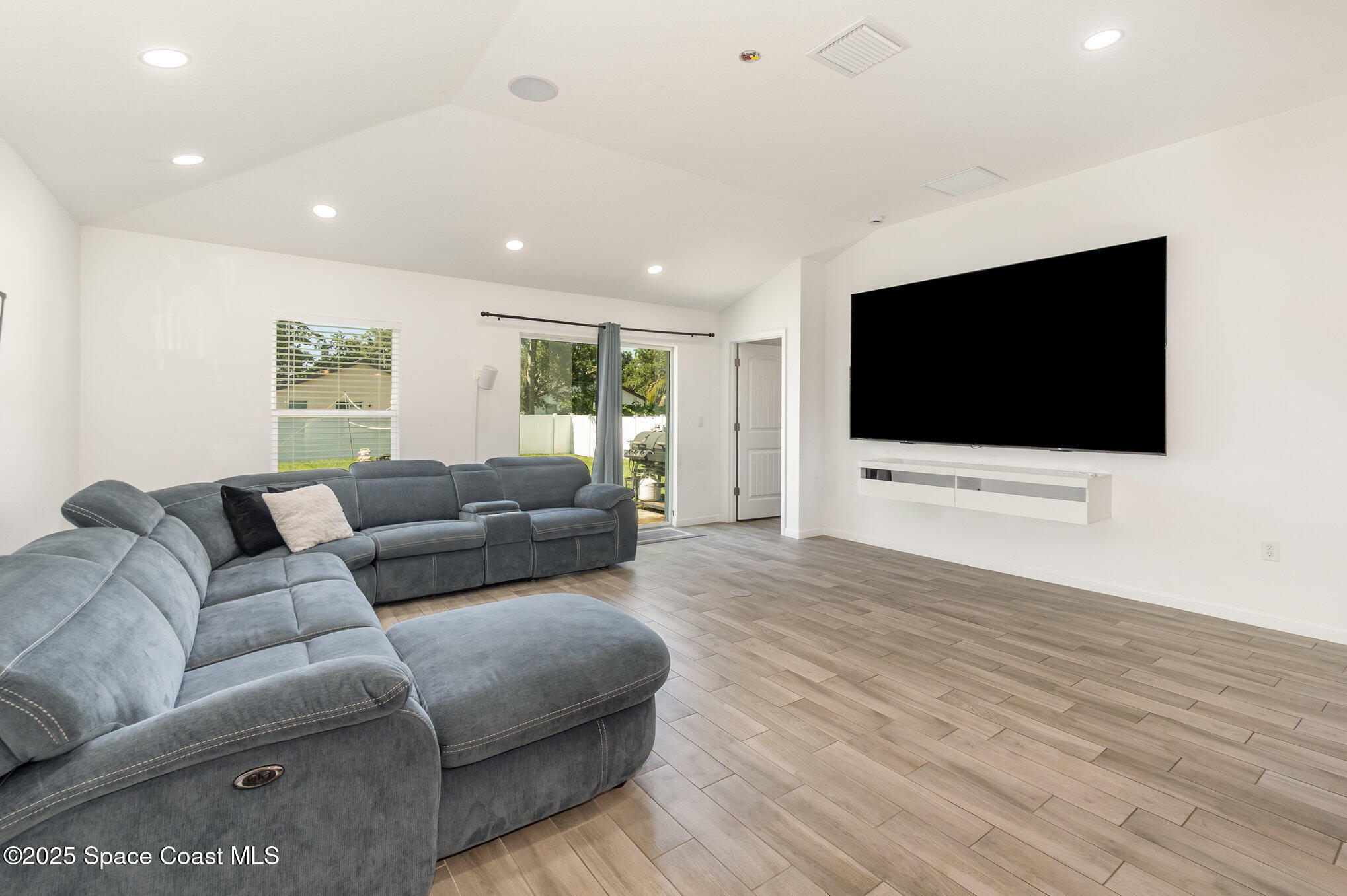 1534 Pine Street Orlando, FL 32824 - Photo 6 of 28 a living room with furniture and a flat screen tv