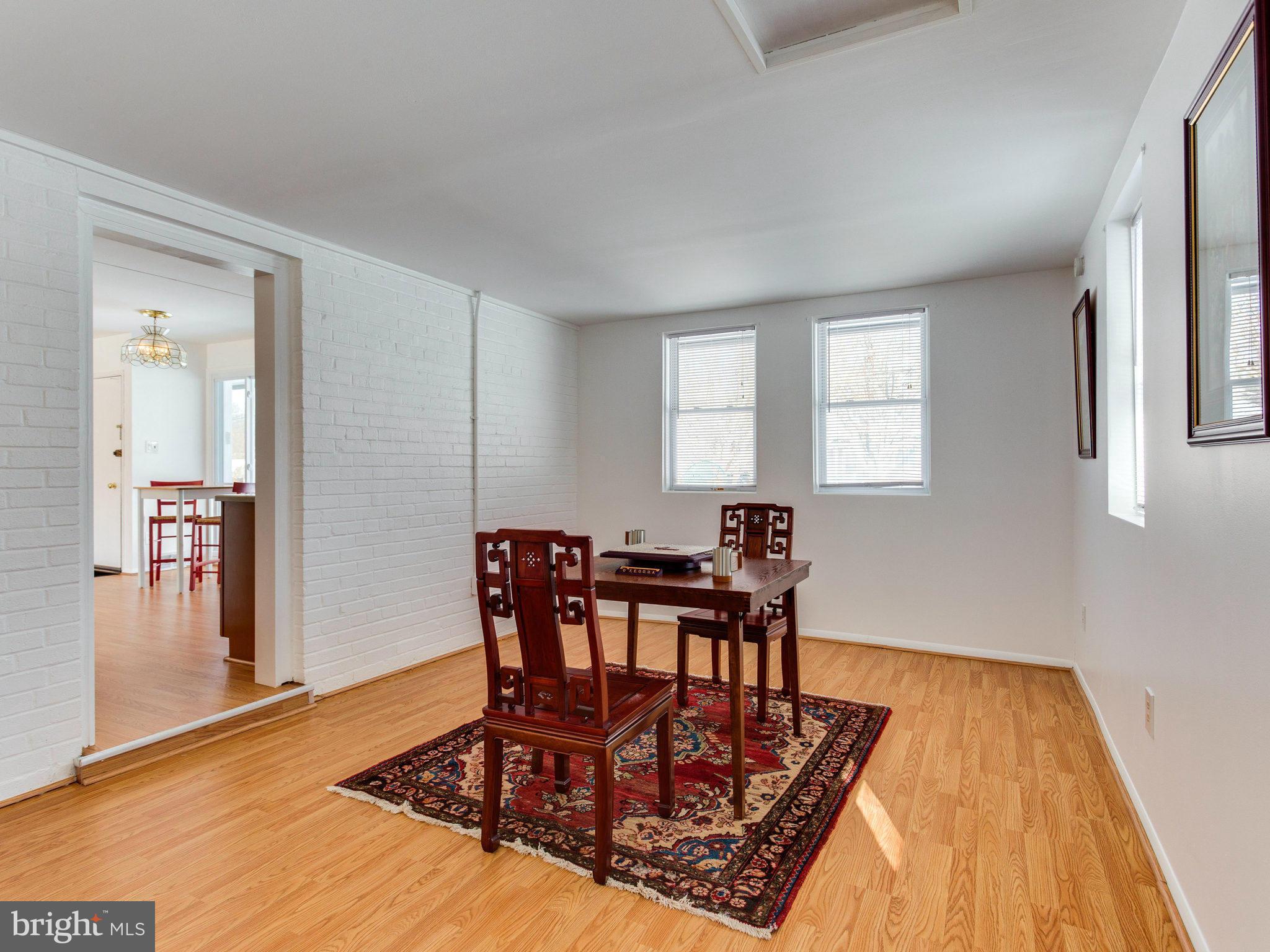 7315 Inzer Street Springfield, VA 22151 - Photo 13 of 23 a view of a dining room with furniture and wooden floor
