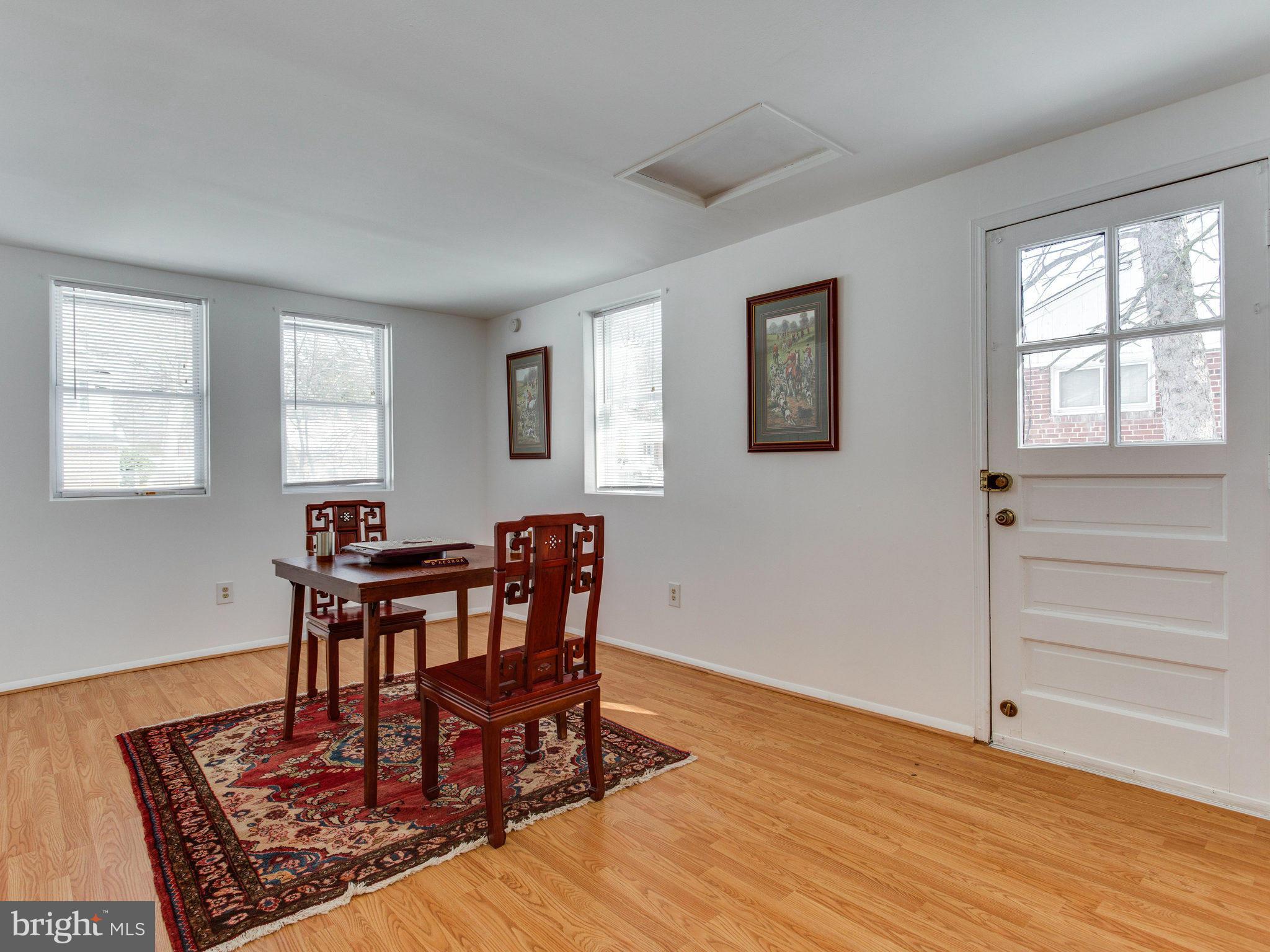 7315 Inzer Street Springfield, VA 22151 - Photo 14 of 23 a view of a dining room with furniture and wooden floor