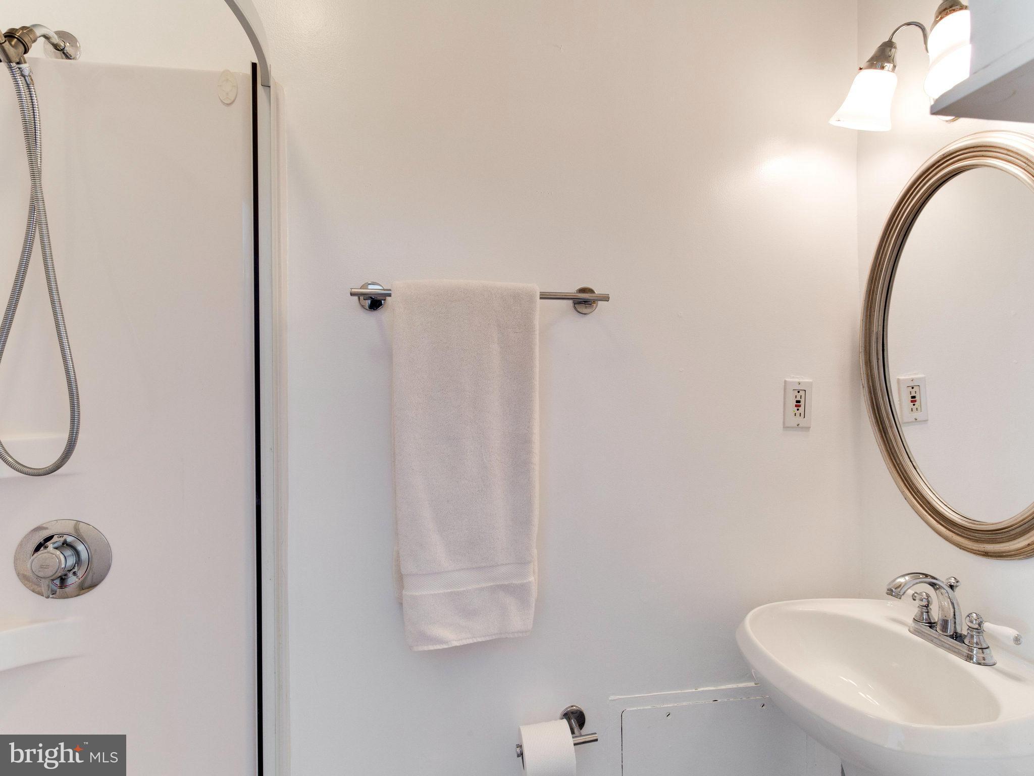 7315 Inzer Street Springfield, VA 22151 - Photo 15 of 23 a bathroom with a sink and a mirror