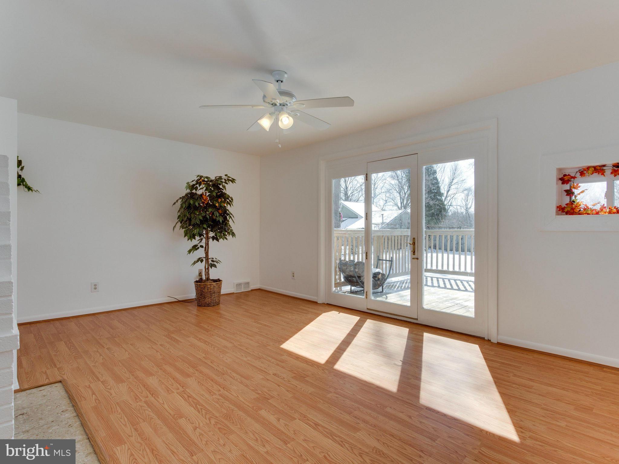 7315 Inzer Street Springfield, VA 22151 - Photo 8 of 23 wooden floor in an empty room with a window