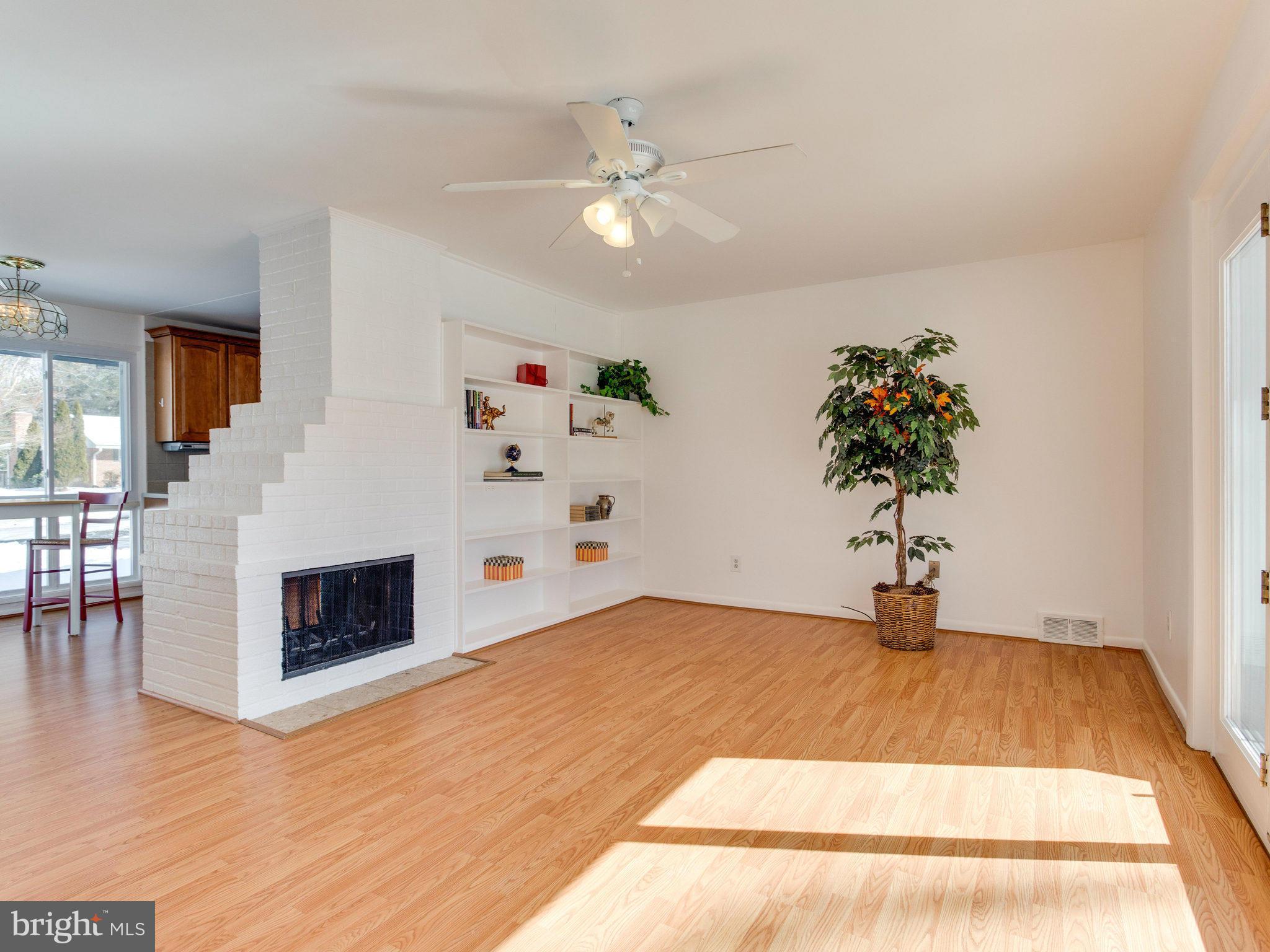 7315 Inzer Street Springfield, VA 22151 - Photo 9 of 23 a living room with furniture and a fireplace