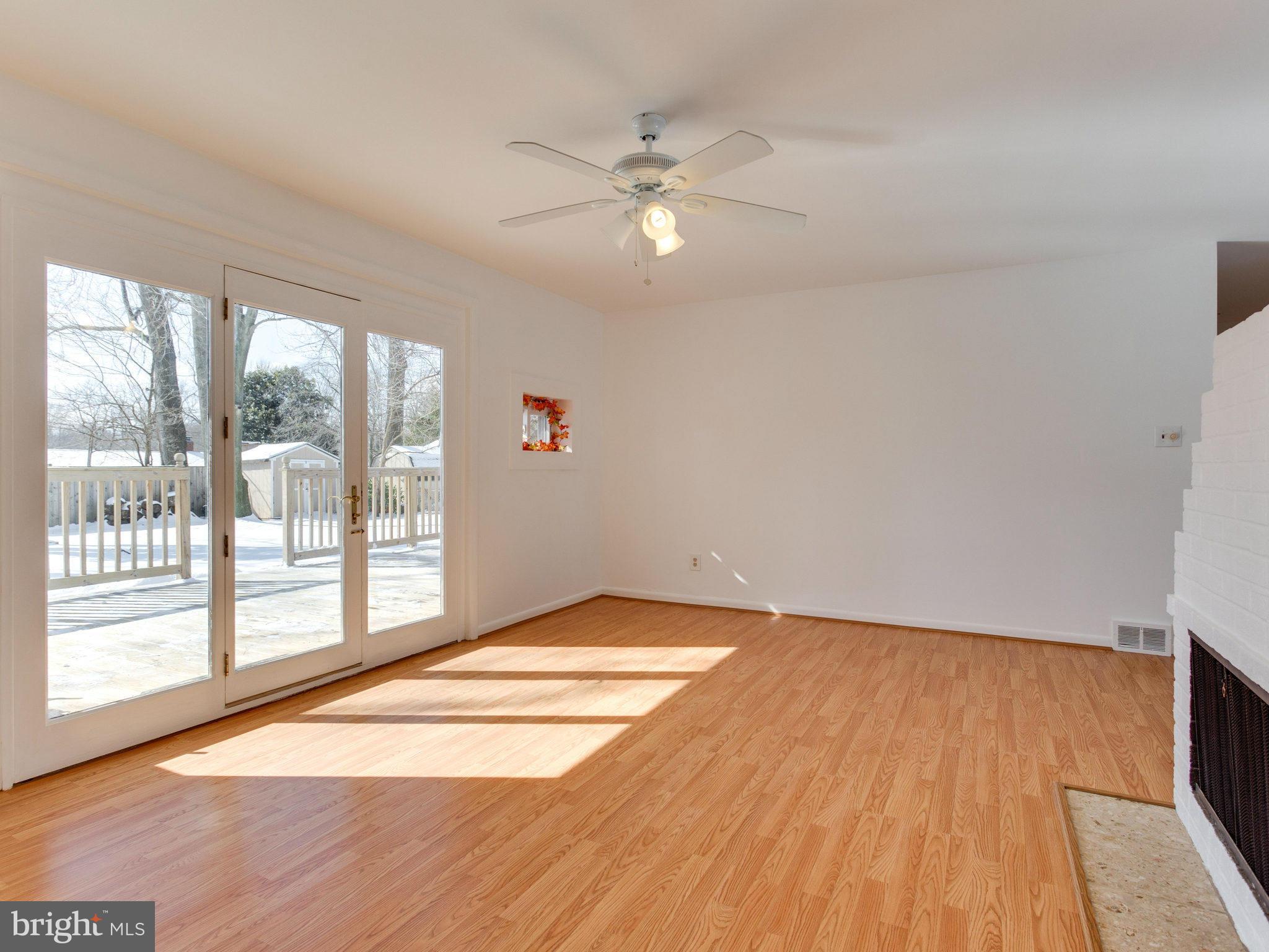 7315 Inzer Street Springfield, VA 22151 - Photo 10 of 23 a view of an empty room with wooden floor and a window