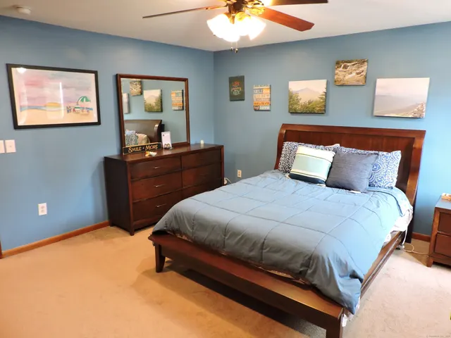 a bedroom with a bed and window