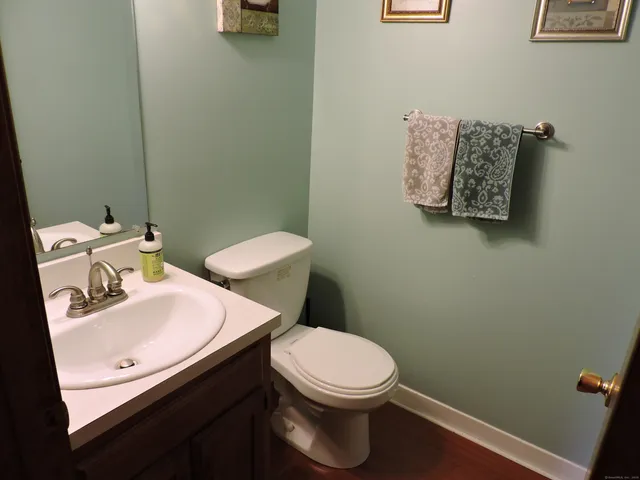 a white toilet sitting next to a bathroom sink