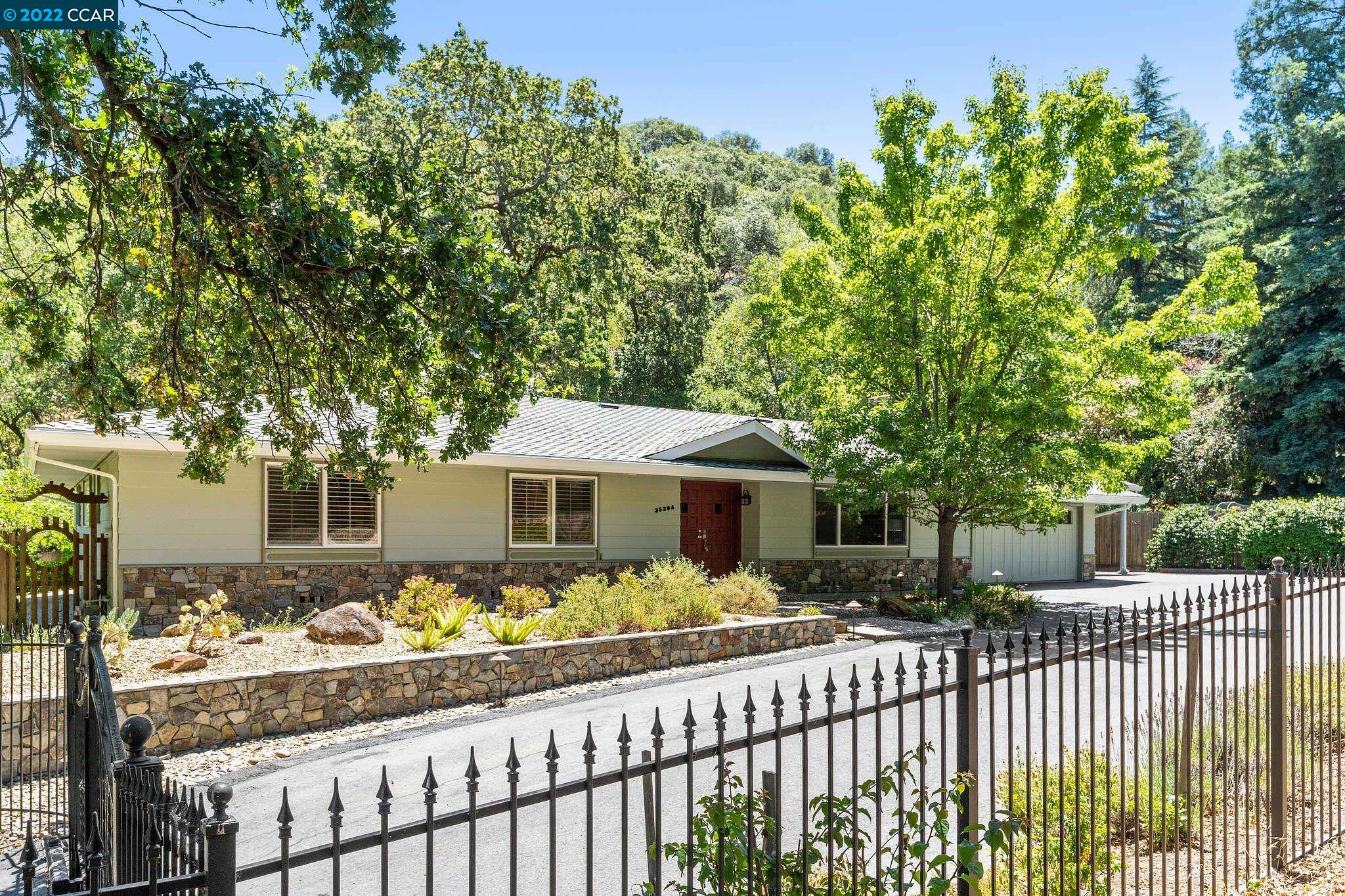 3539 A Springhill Road Lafayette, CA 94549 - Photo 1 of 1 a front view of a house with a yard