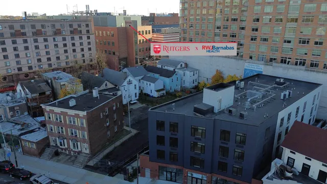 a buildings covered with tall trees
