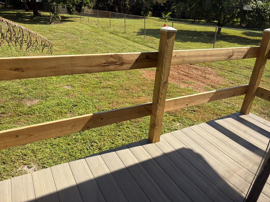 14131 Northwest 3rd Avenue, Unit F Miami, FL 33168 - Photo 4 of 7 a view of a swimming pool with an outdoor seating