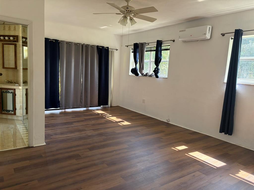 14131 Northwest 3rd Avenue, Unit F Miami, FL 33168 - Photo 7 of 7 a view of a livingroom with wooden floor