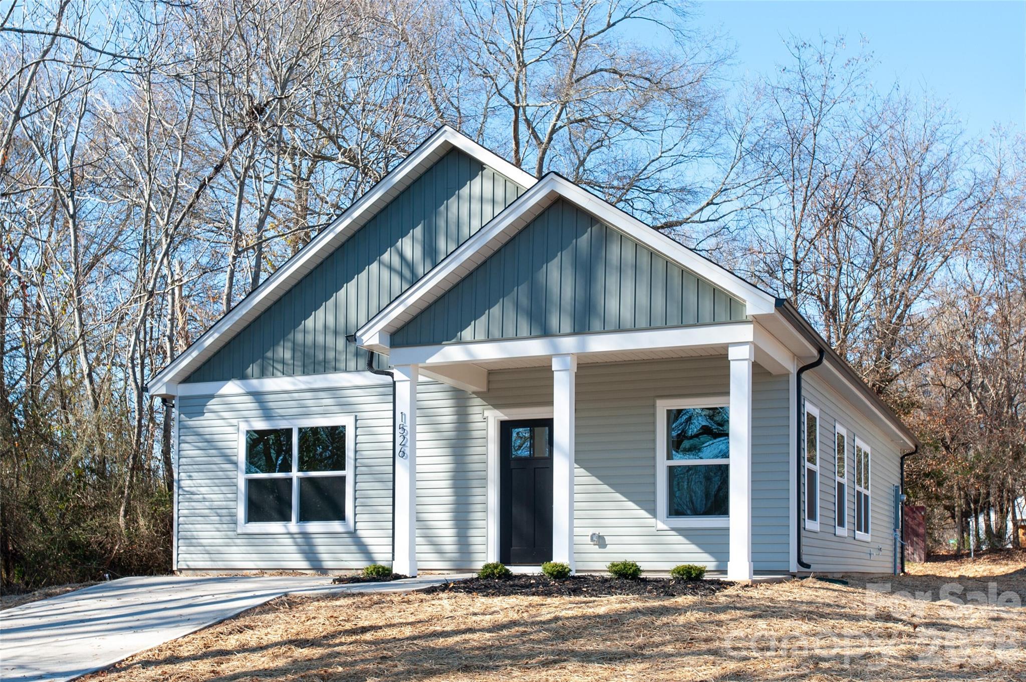 0 Lowesville Meadows Road Stanley, NC 28164 - Photo 1 of 25 a front view of a house with a garden