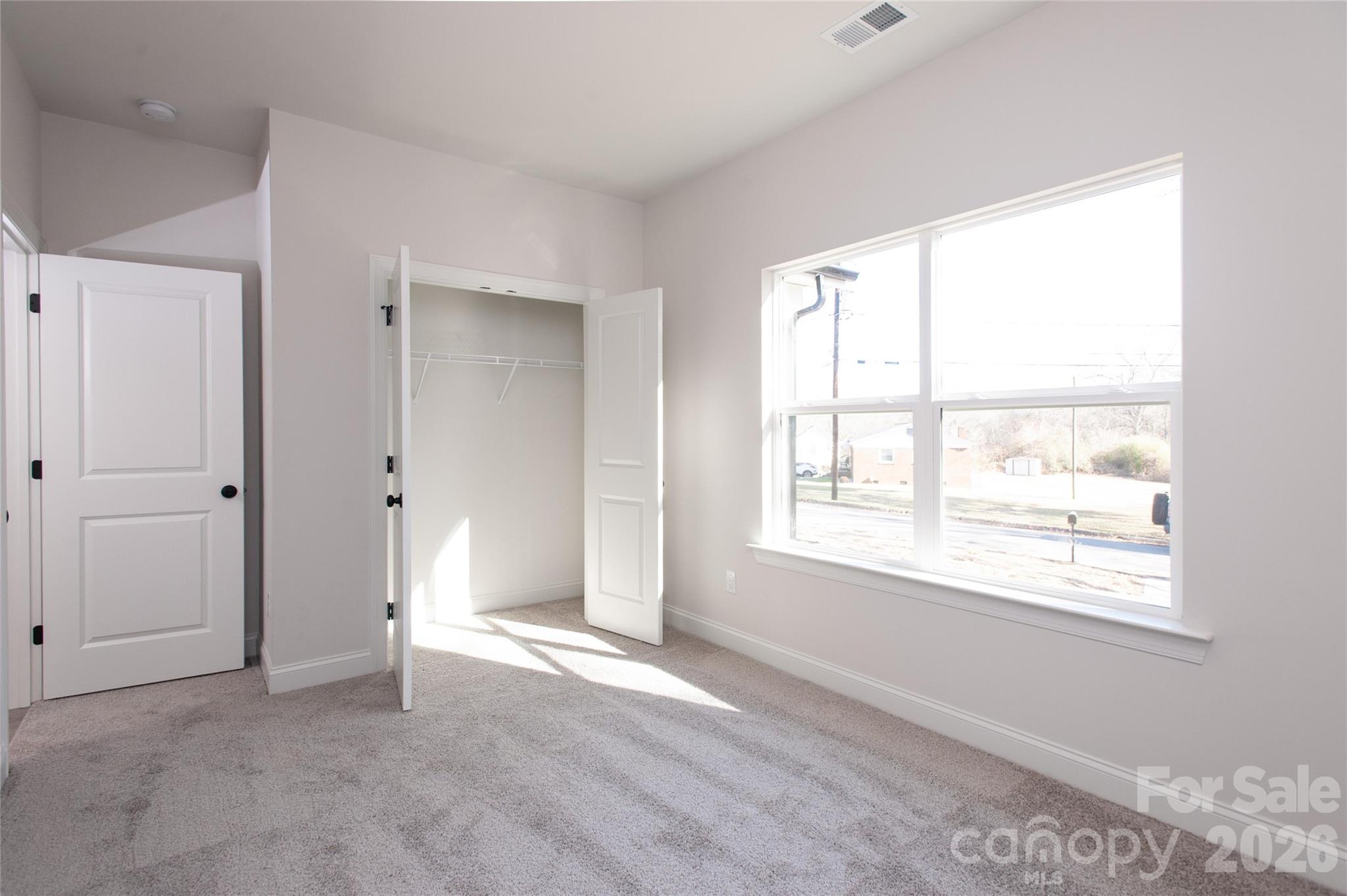 0 Lowesville Meadows Road Stanley, NC 28164 - Photo 21 of 25 a view of an empty room with a window