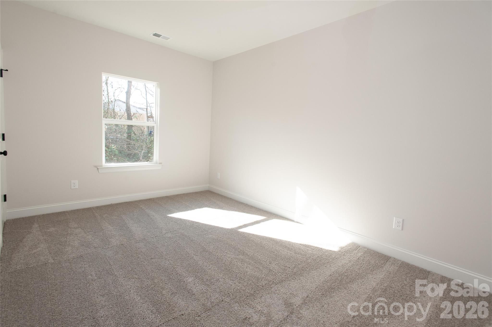 0 Lowesville Meadows Road Stanley, NC 28164 - Photo 24 of 25 an empty room with a window