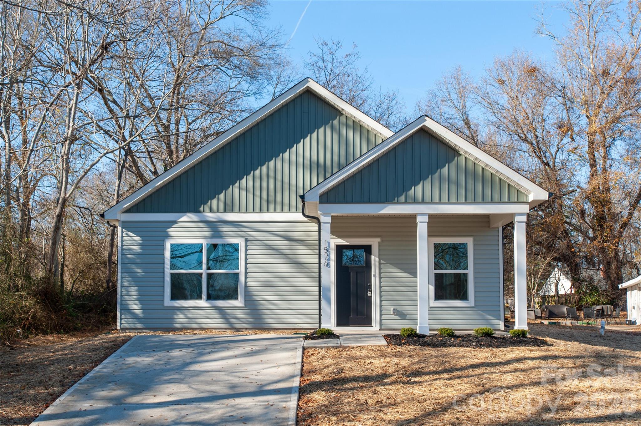 0 Lowesville Meadows Road Stanley, NC 28164 - Photo 3 of 25 a front view of a house with a garden