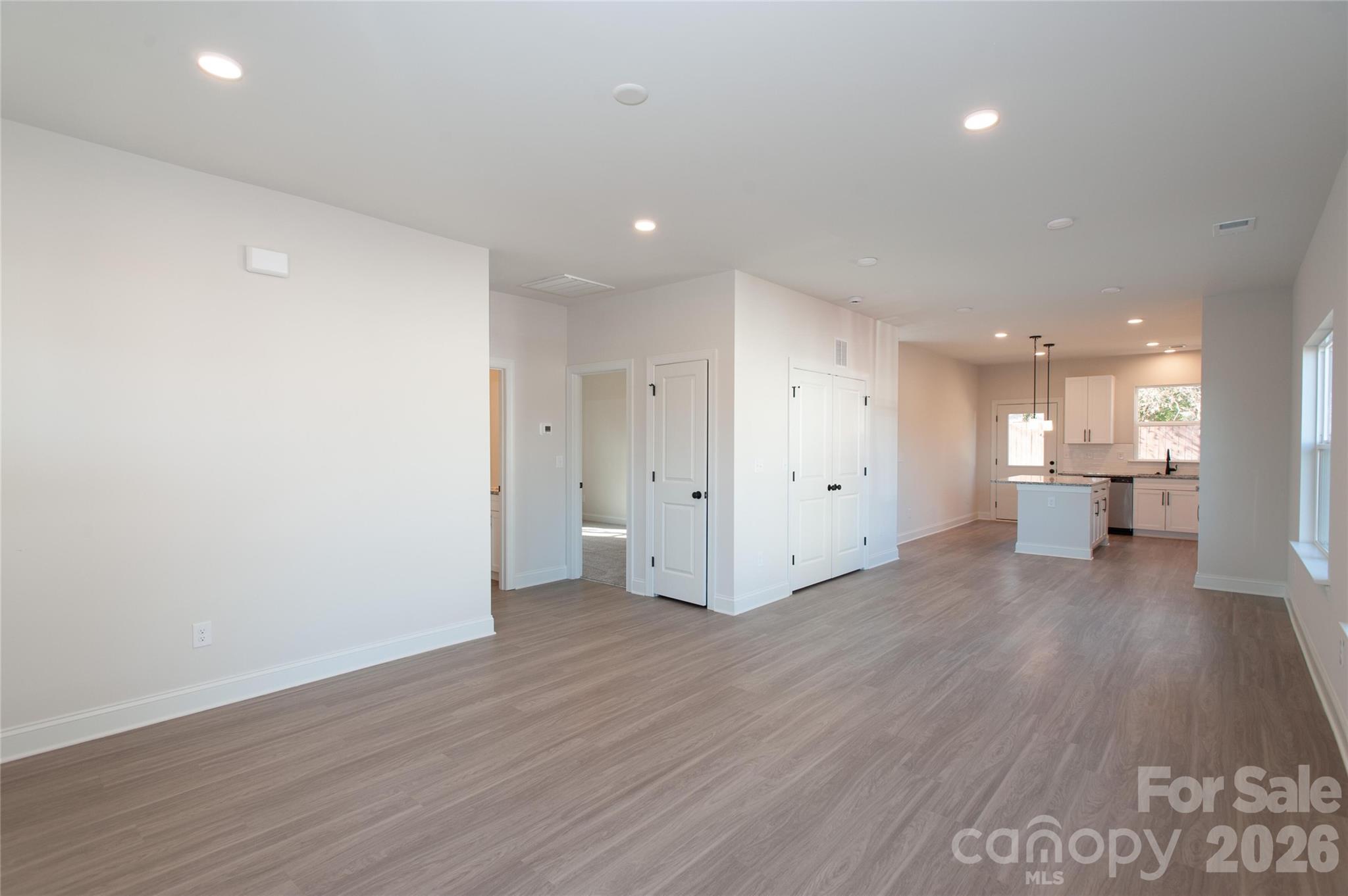 0 Lowesville Meadows Road Stanley, NC 28164 - Photo 8 of 25 a view of a big room with wooden floor and windows