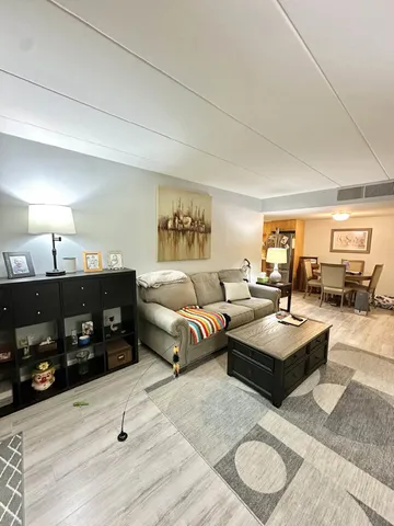 a living room with furniture or couch and a flat screen tv