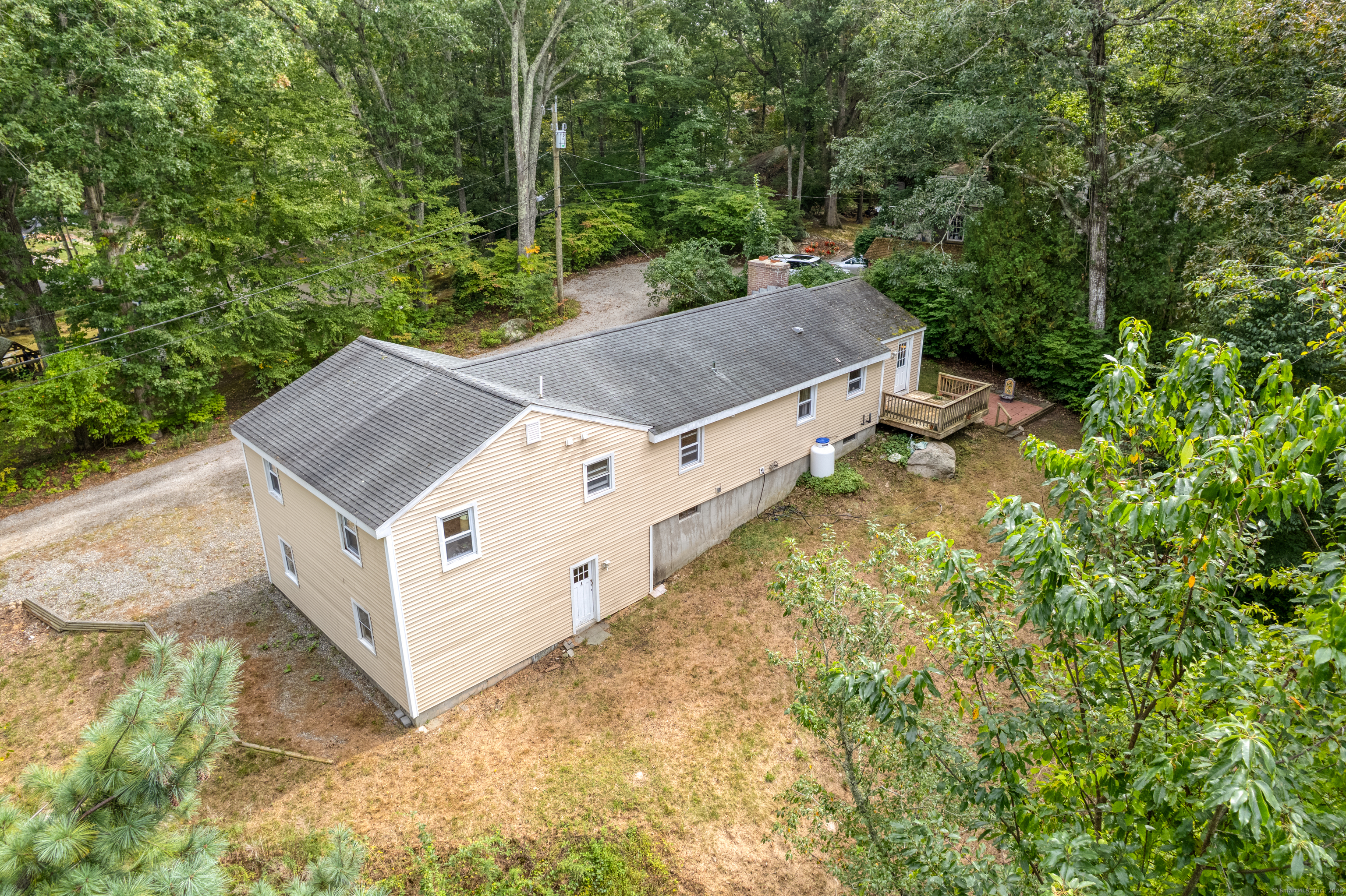 239 A Rockledge Road Lyme, CT 06371 - Photo 28 of 30 a view of a house with a yard and sitting area
