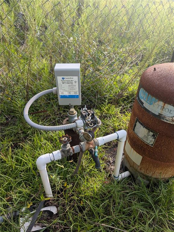 10404 Southwest 170th Street Archer, FL 32618 - Photo 5 of 10 a view of a chairs in a backyard