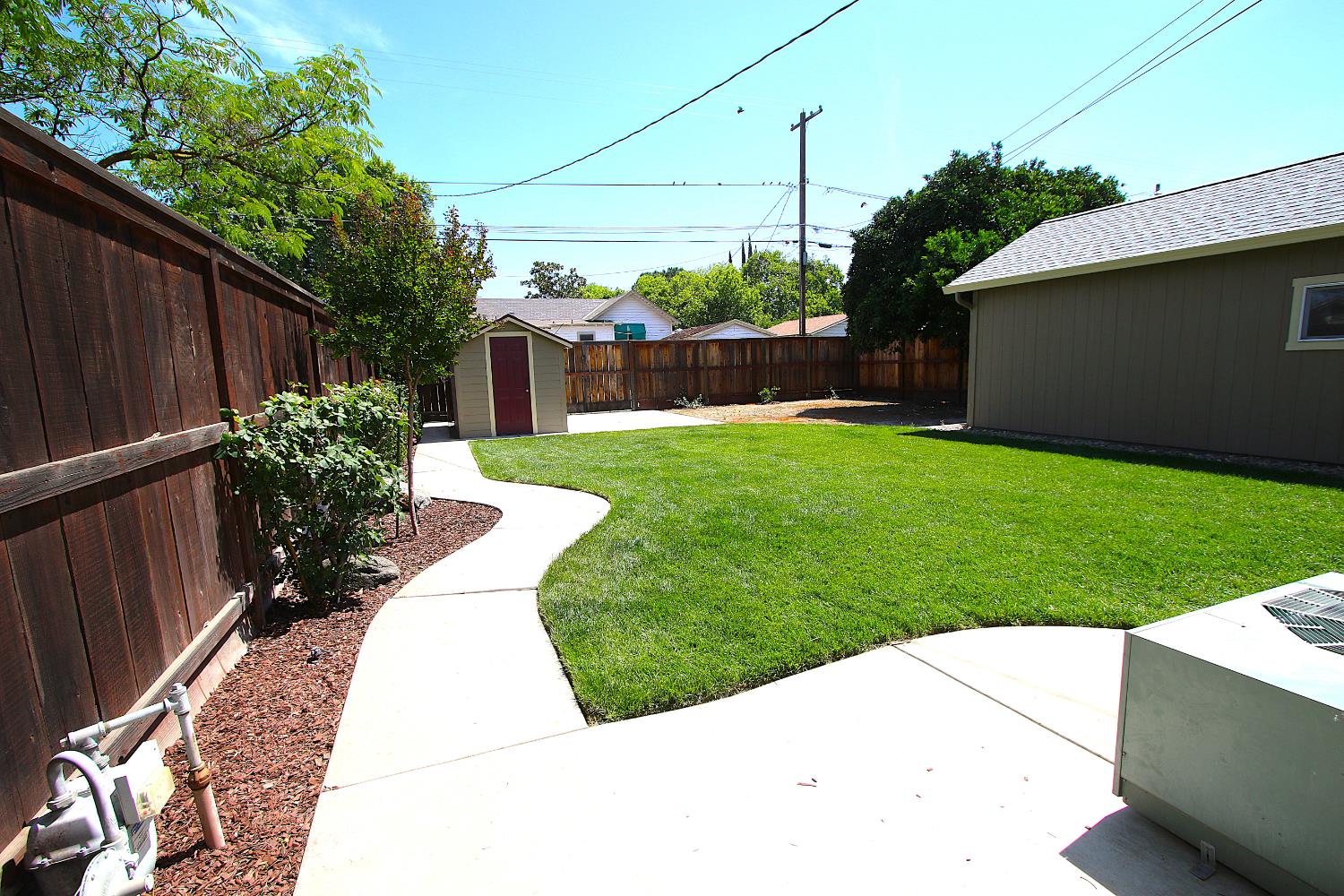526 Melrose Street Modesto, CA 95354 - Photo 26 of 27 a view of a backyard with wooden fence