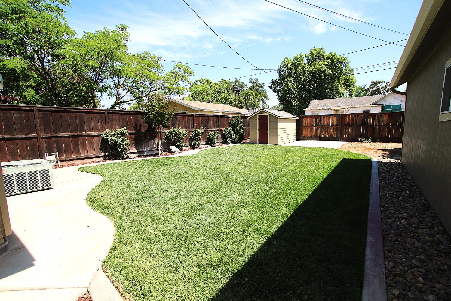 526 Melrose Street Modesto, CA 95354 - Photo 27 of 27 a view of a house with backyard porch and sitting area