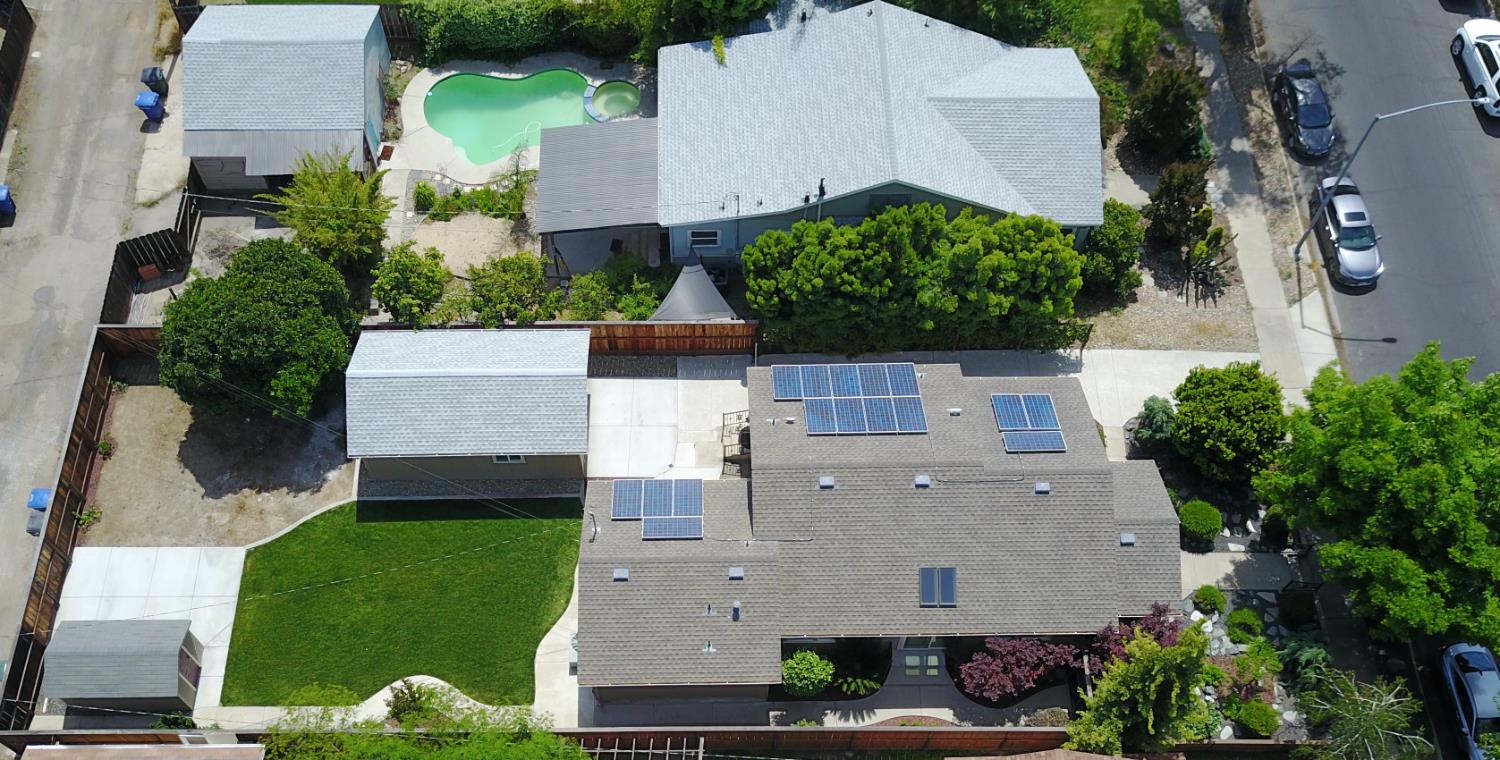 526 Melrose Street Modesto, CA 95354 - Photo 5 of 27 an aerial view of a house with a garden and trees