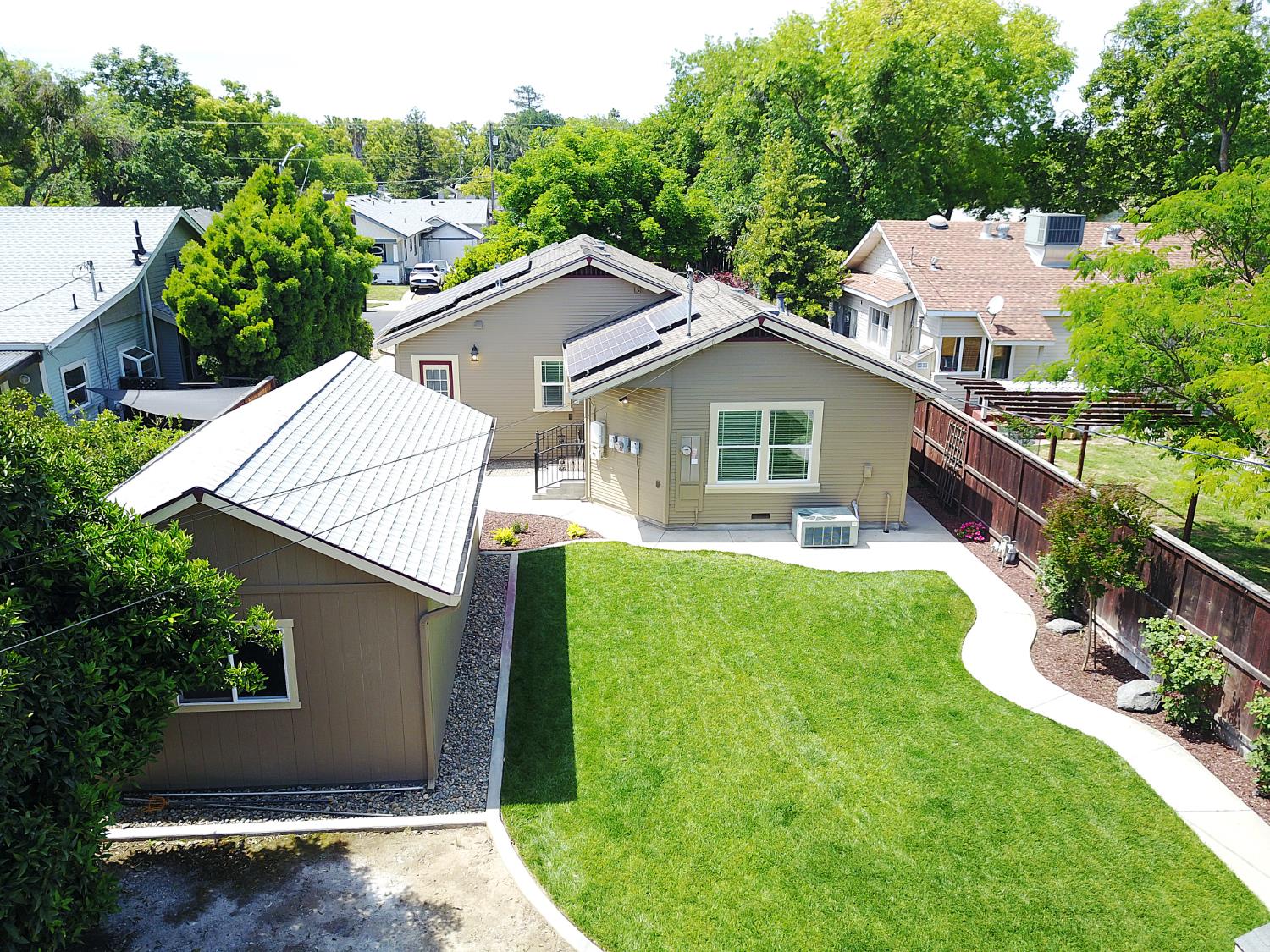 526 Melrose Street Modesto, CA 95354 - Photo 6 of 27 a aerial view of a house with a yard and potted plants