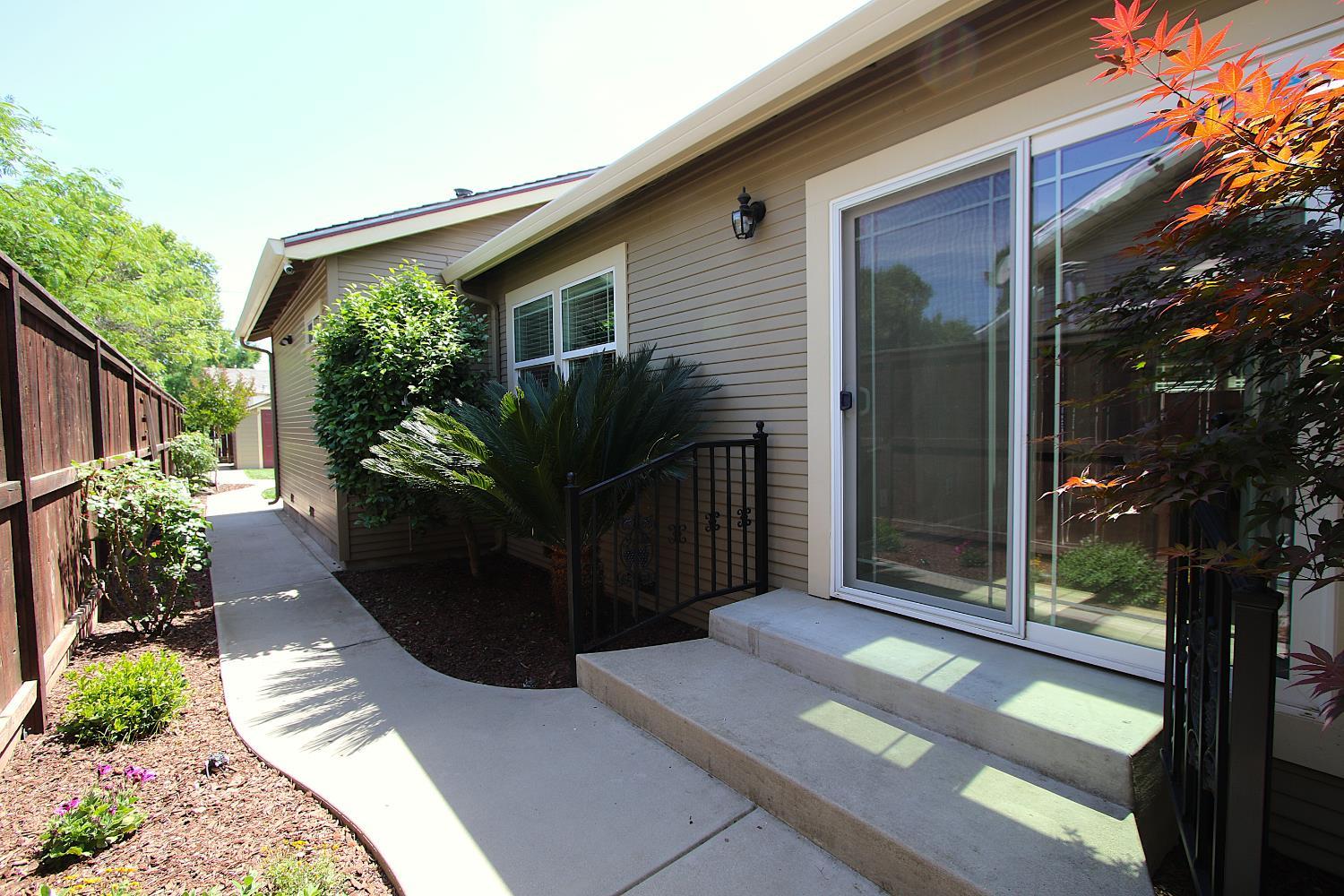 526 Melrose Street Modesto, CA 95354 - Photo 9 of 27 a view of a pathway with a garden